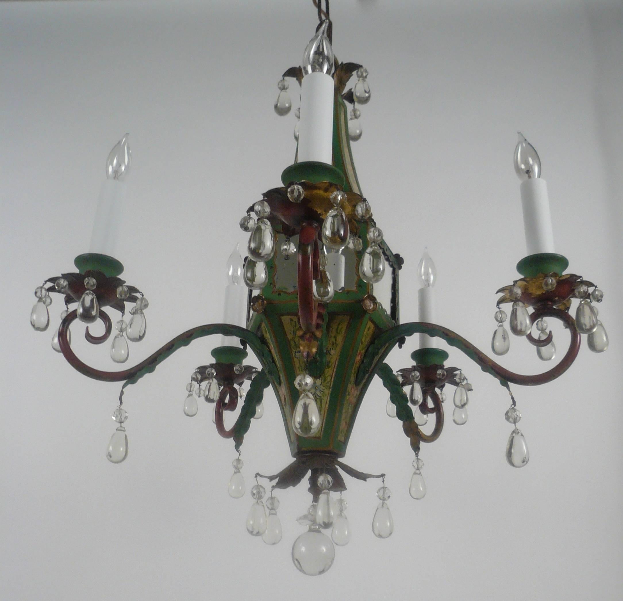 This whimsical Regency Brighton Pavilion style floral painted tole, mirror, and crystal chandelier is attributed to E. F. Caldwell, and is pictured in their archives.