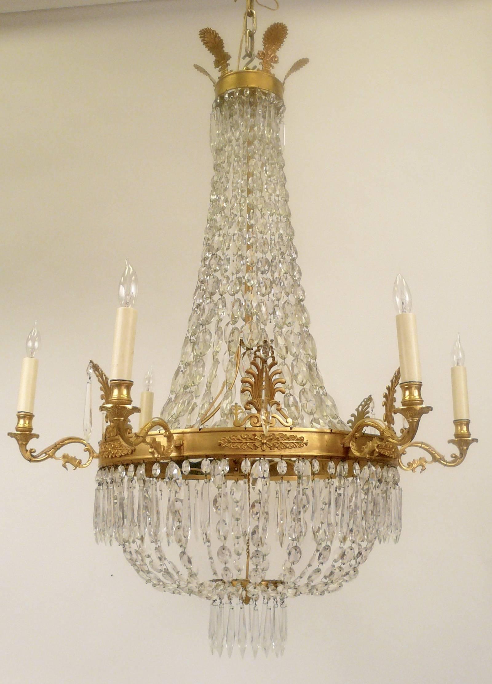 This bronze and crystal six-light chandelier is of fine proportion and has a beautiful gilt finish.
