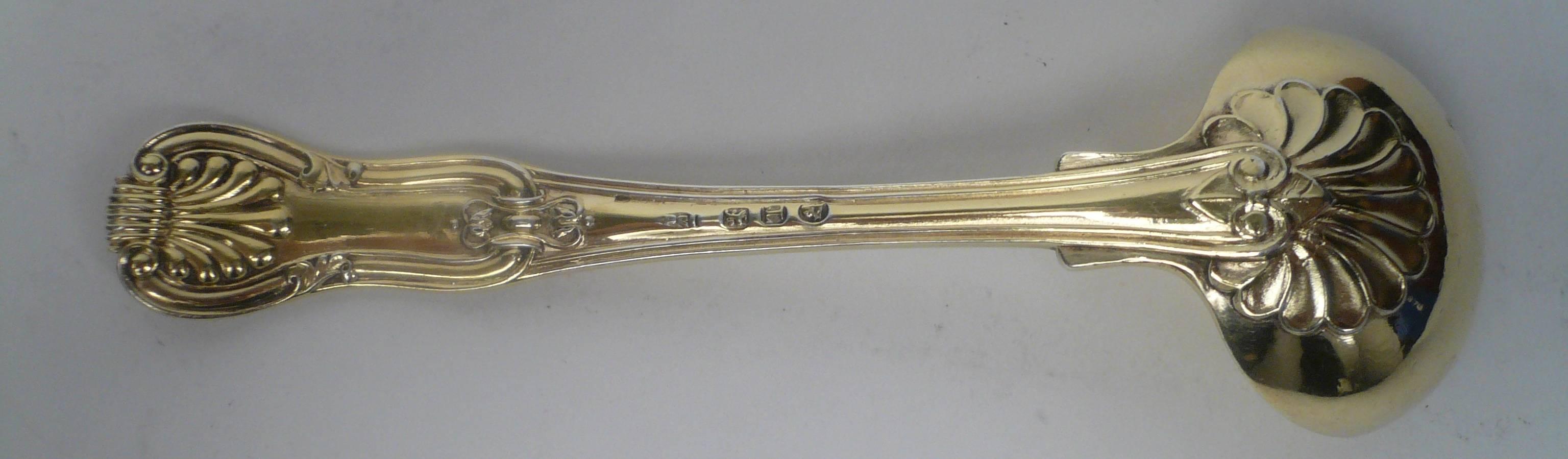 English Regency silver gilt ladle in the King pattern by Paul Storr