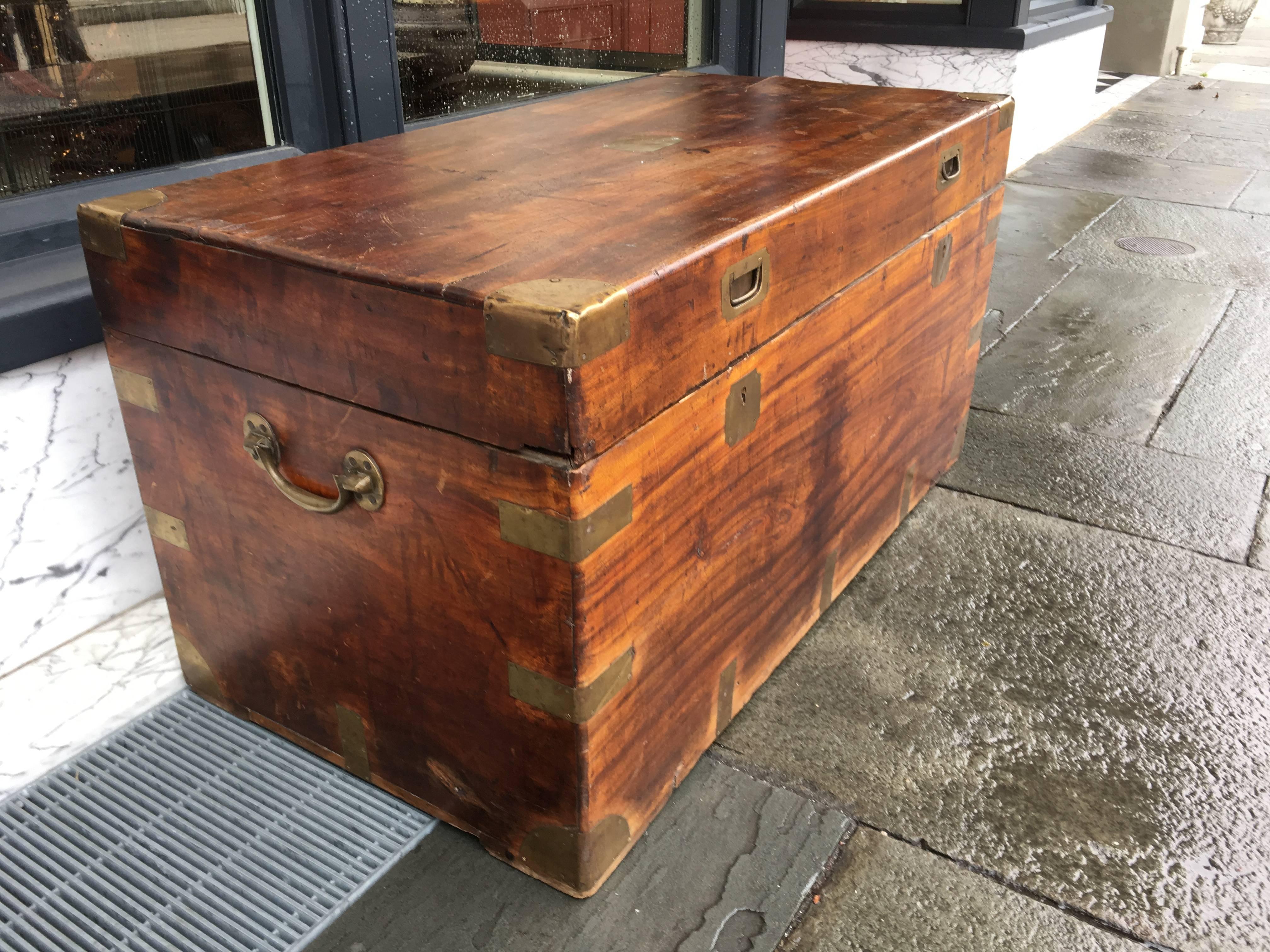 English camphor wood late 19th century trunk with brass accents and lockable top.