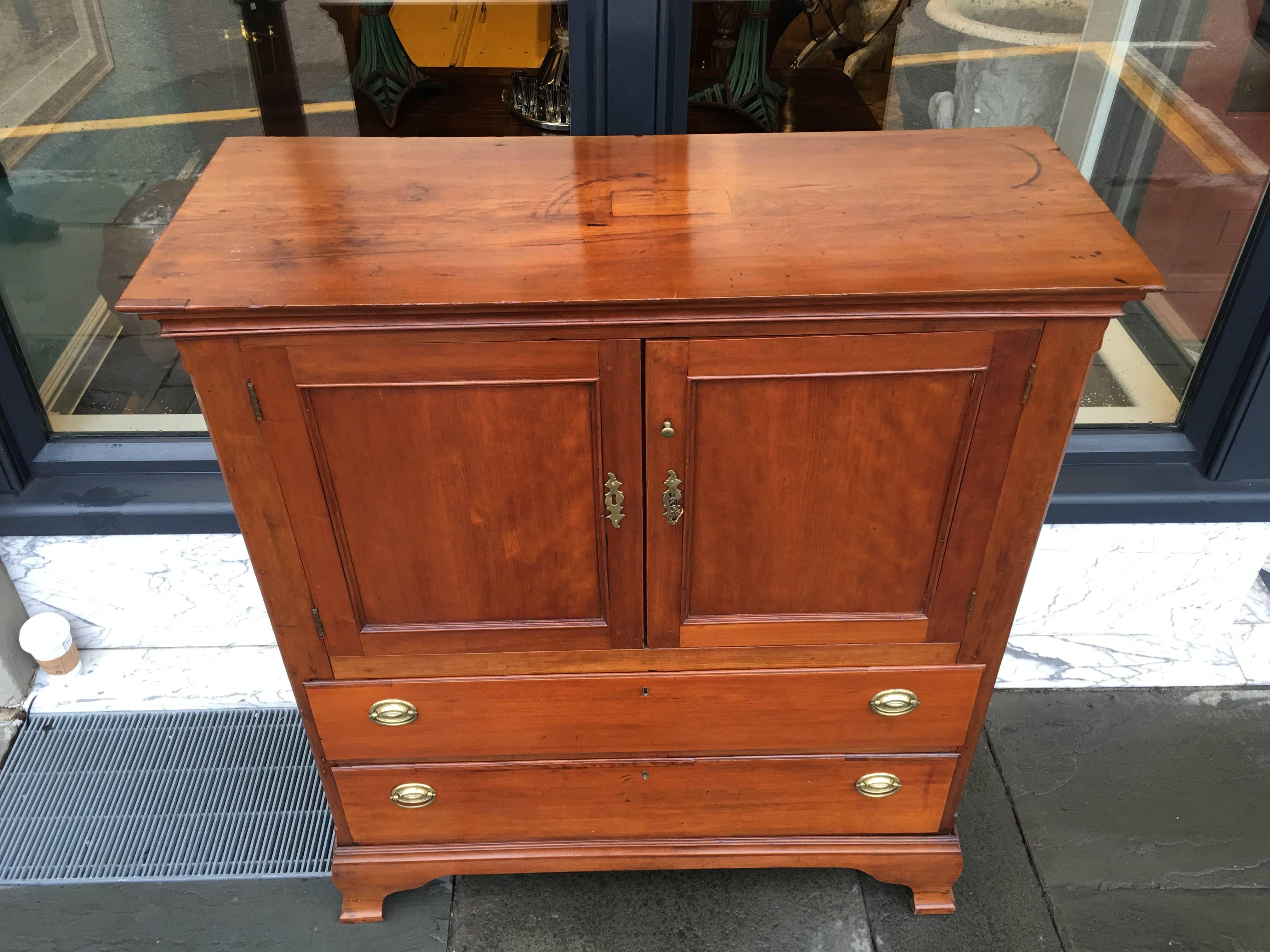 Very unique size Southern American cherry linen press. Great bracket foot with two drawers and small top or (press section).
