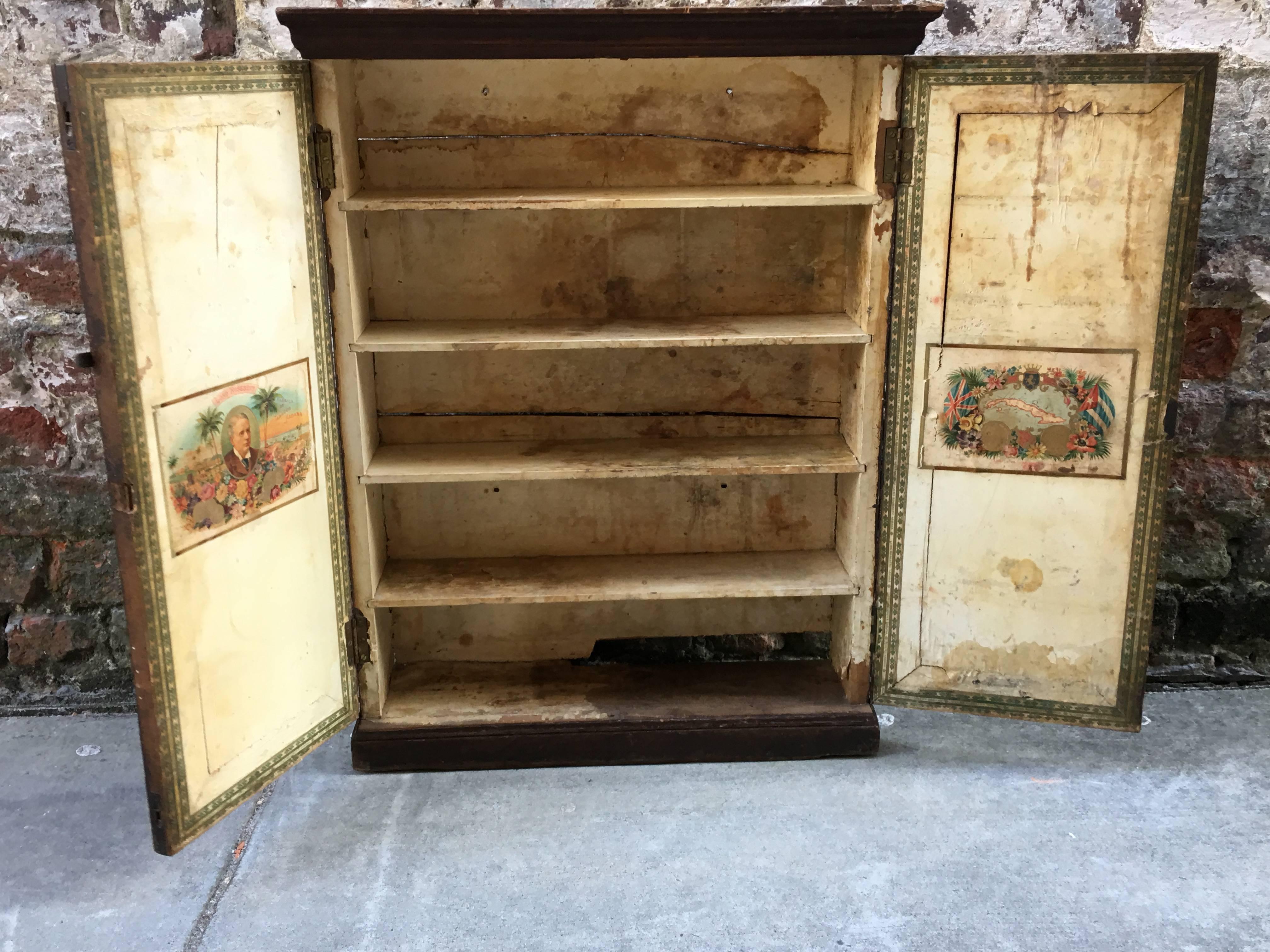 Late 19th Century Cuban Wall Cabinet with Decorative Cigar Labels Applied