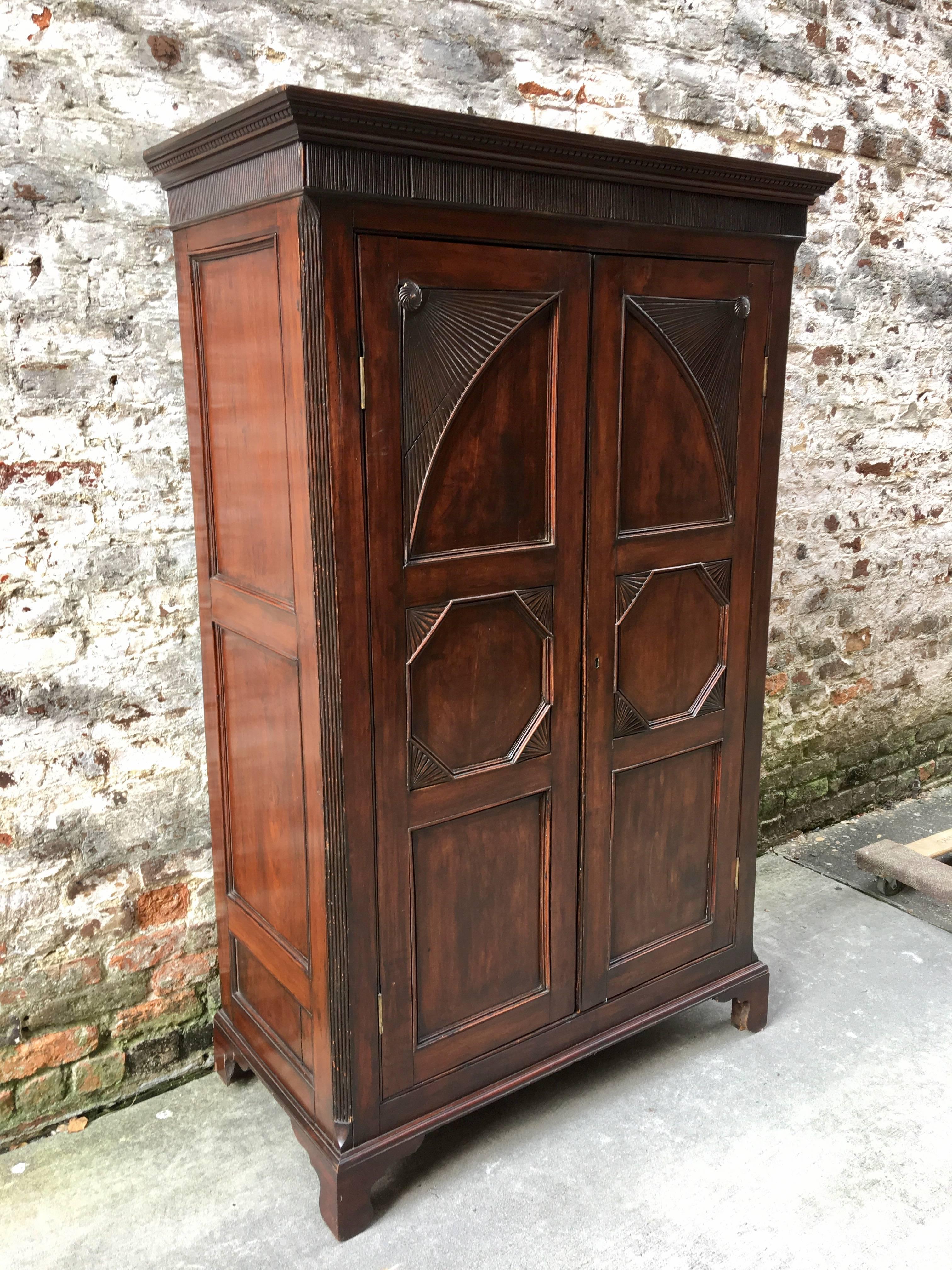 West Indian mahogany armoire with bottom drawers, circa 1820.