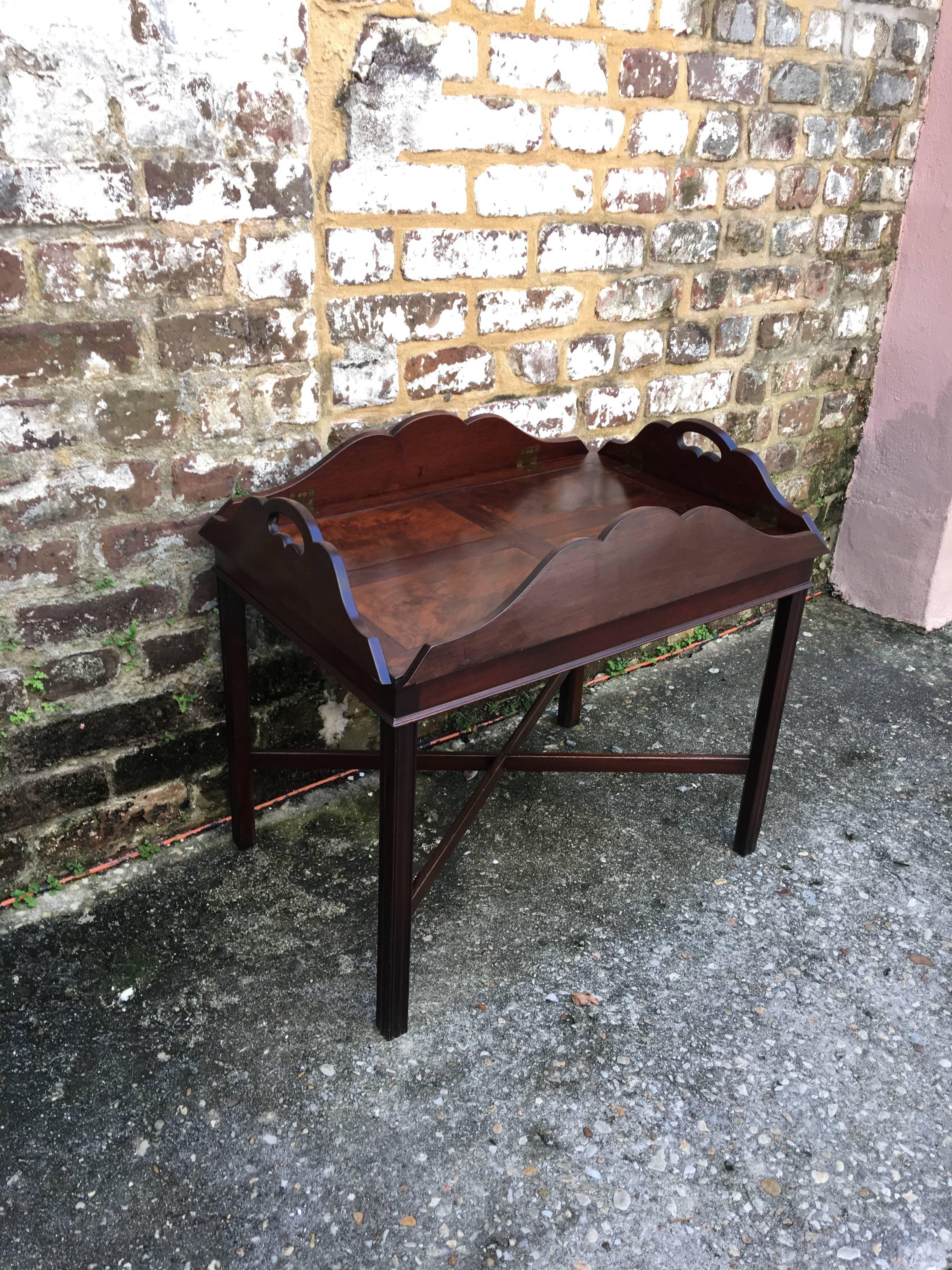 Fantastic shaped top English butlers tray on stand. 
Molded leg with stretcher base