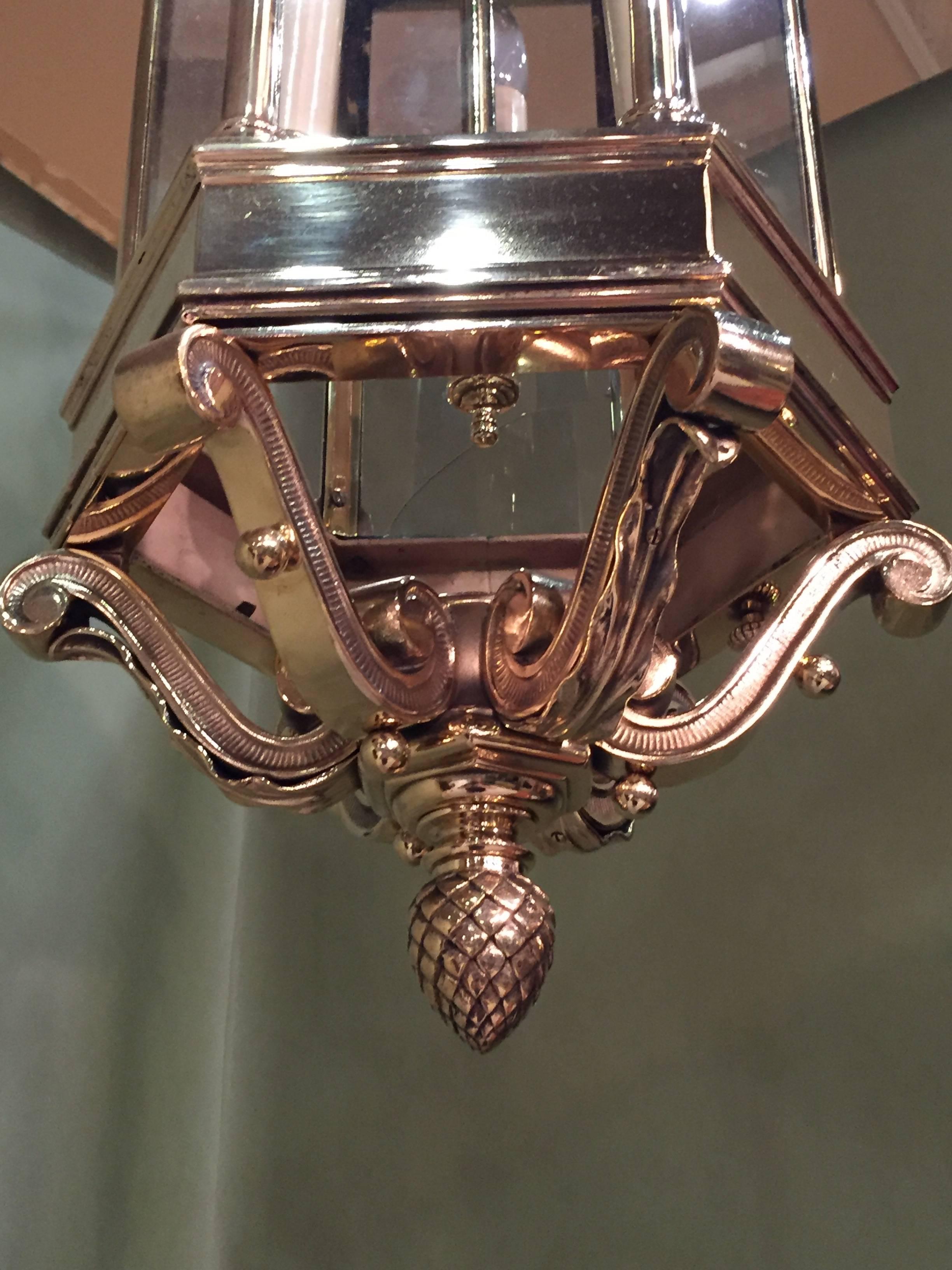 English late 19th century hall lantern with heavy cast brass detail on base. Rewired and UL listed sockets.