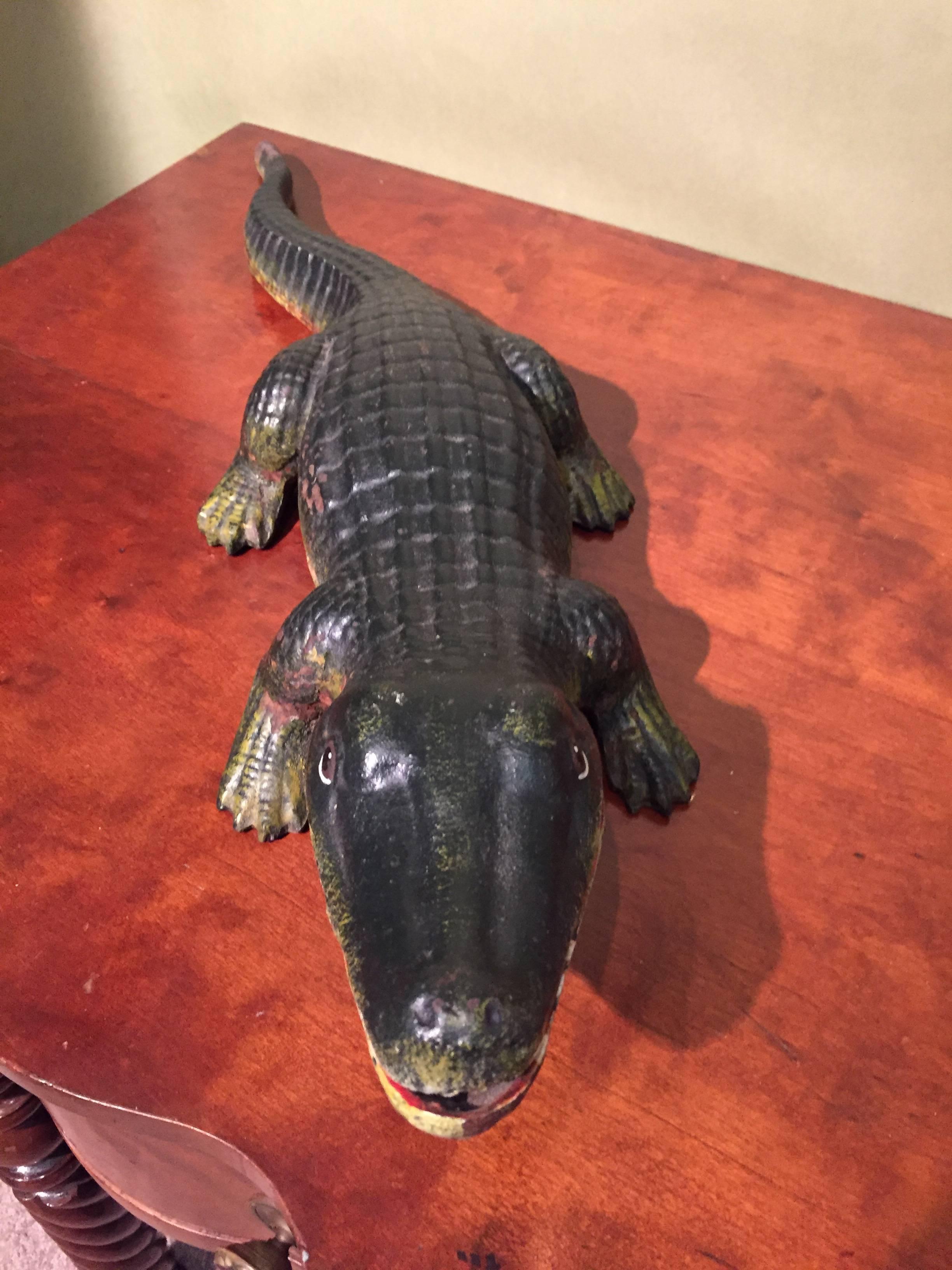Cast iron 20th century alligator doorstop in original paint.