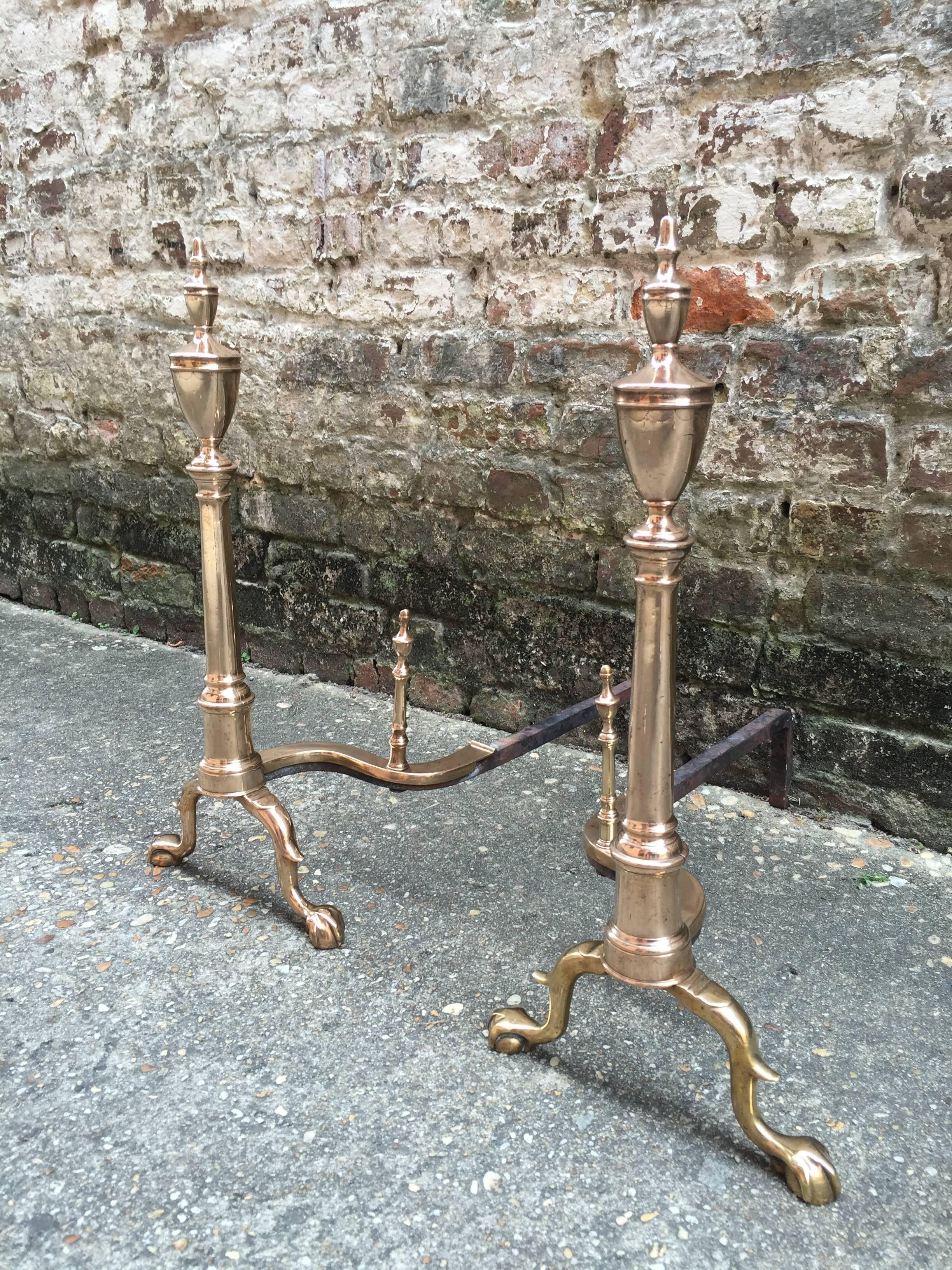 Pair of American paw foot andirons from the late 18th century.