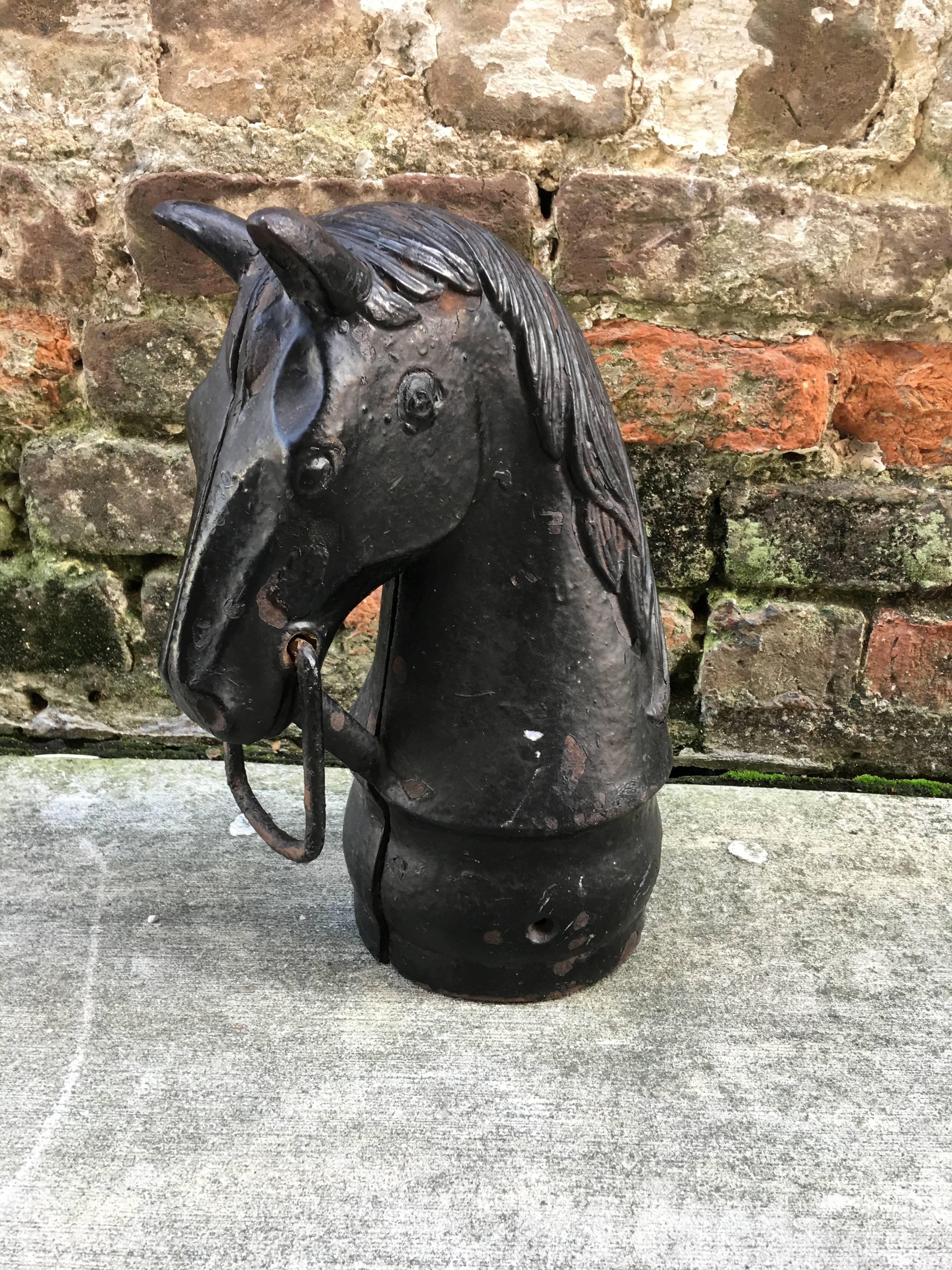 Cast iron horse head hitching post from the late 19th century. Very nice size due to base diameter being 6