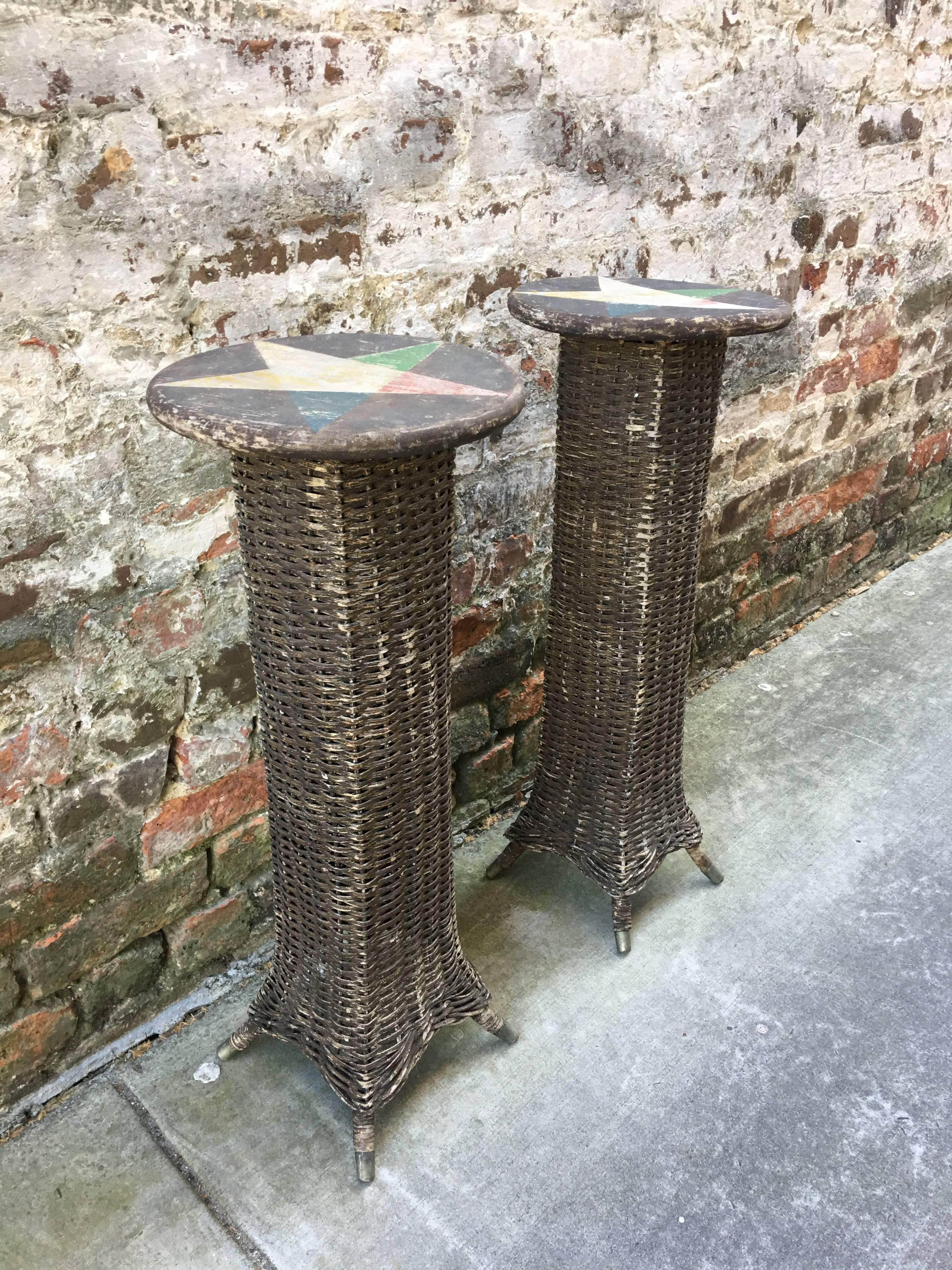 Pair of wicker plant stands with star motif tops from the 1930s.
