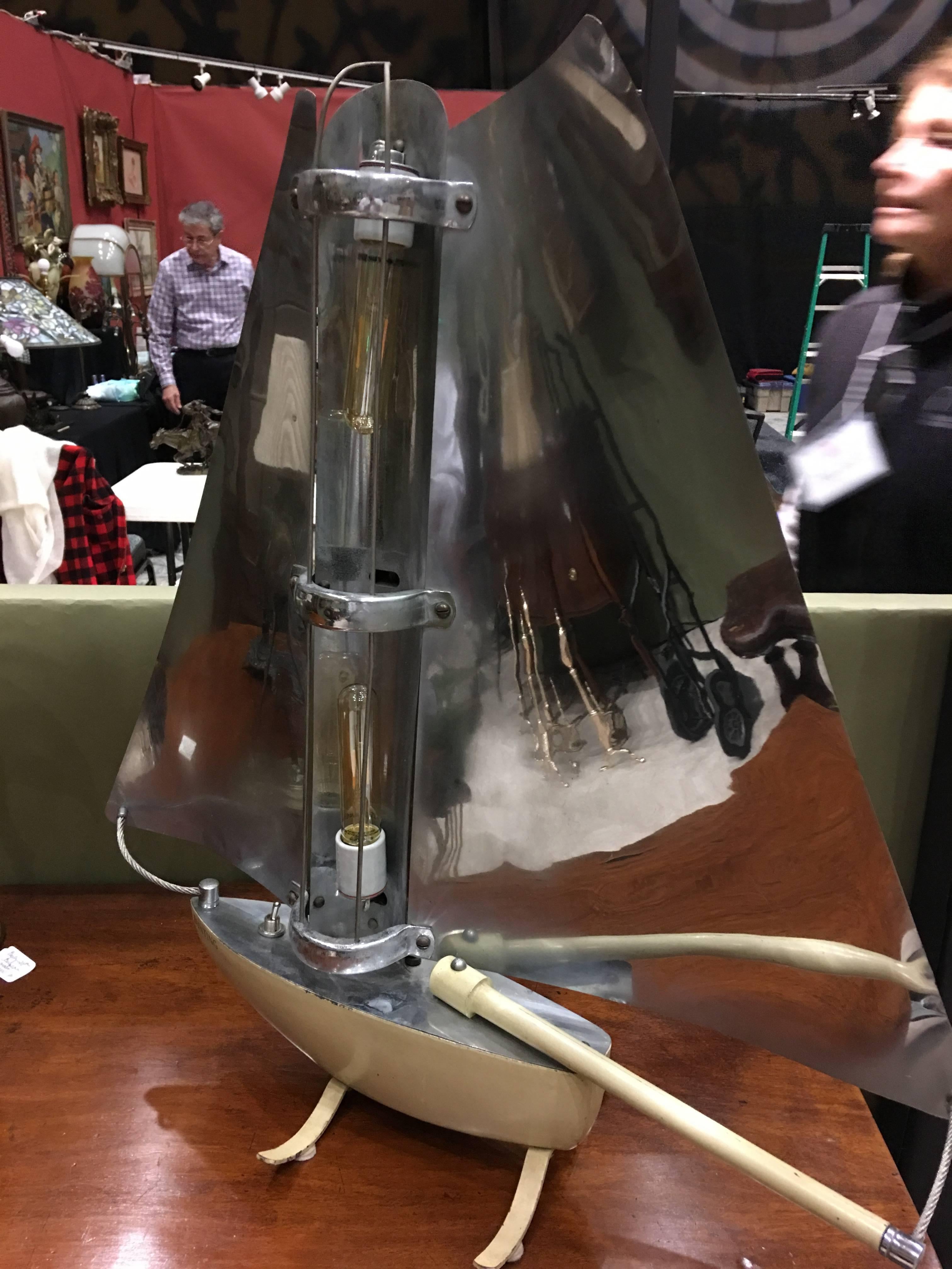 English space heater in form of a sailboat that has been converted to a desk lamp, 20th century.