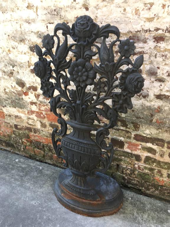 English Iron Garden Ornament with oversized floral motif projecting from urn For Sale at 1stdibs
