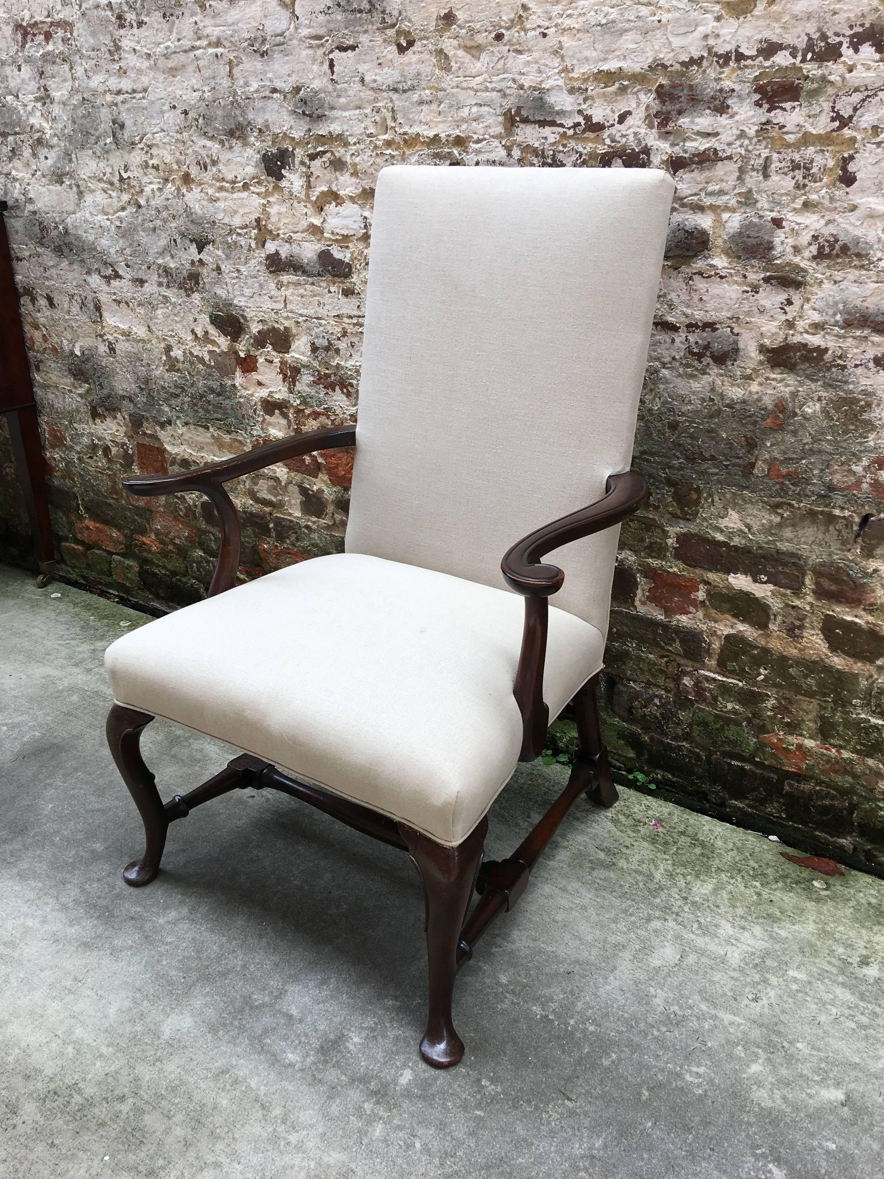 English mahogany armchair with pad foot and turned stretcher base.