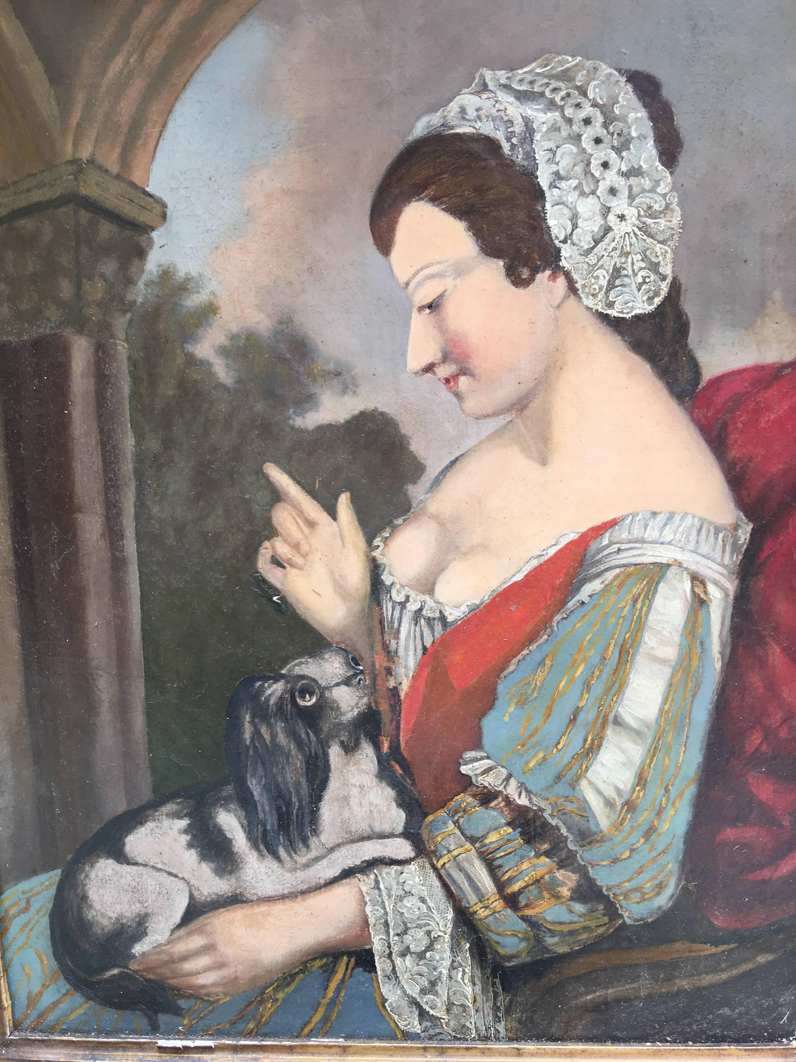 Oil on canvas of lady with King Charles Cavalier spaniel on lap.