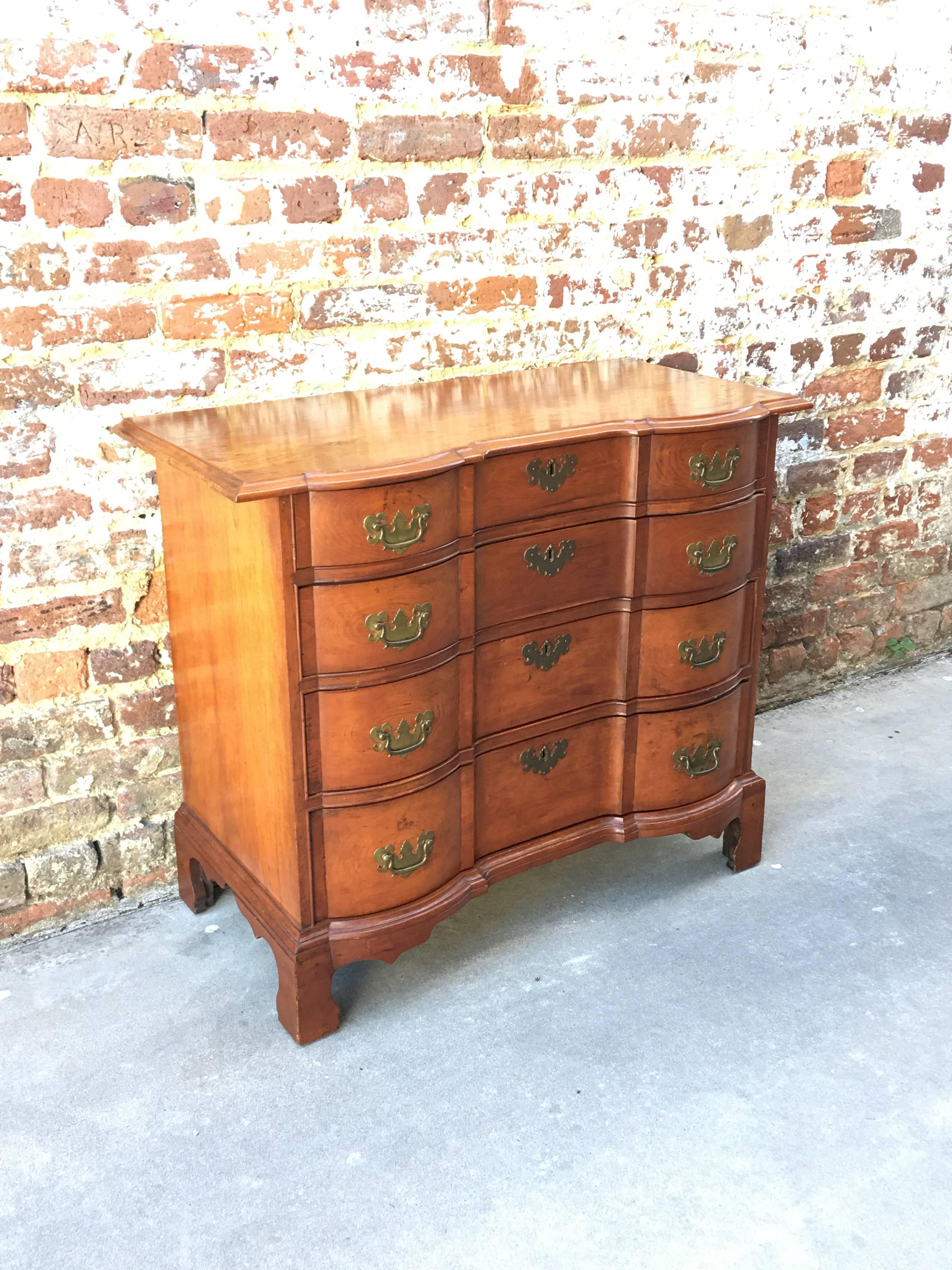 An American block front chest, circa 1765. Overhanging top with original bracket foot. CT likely Hartford.