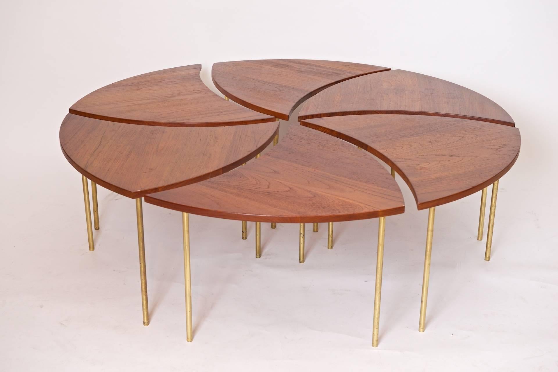 Solid teak segmented coffee table with brass legs by Peter Hvidt and Orla Mølgaard-Nielsen

Tables can be configured in several ways. Can also be stacked

France and Son. Metal Labels present on each section

