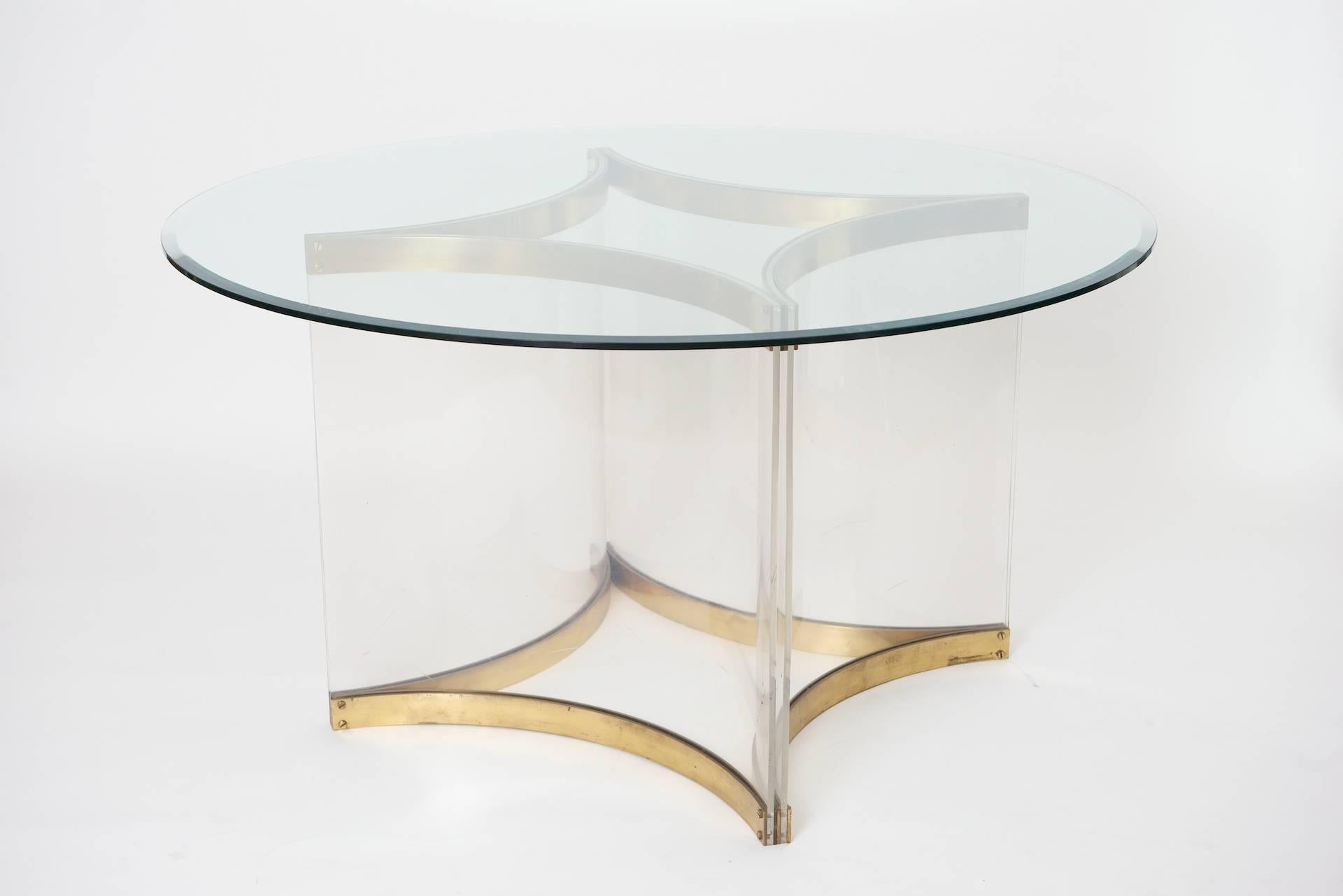 Alessandro Albrizzi circular table.
Curved Lucite base with brass.

The lucite and brass base can take a larger top if necessary. The shape could also be changed if desired. Can be circular, square, hexagonal or rectangular.

This table can be
