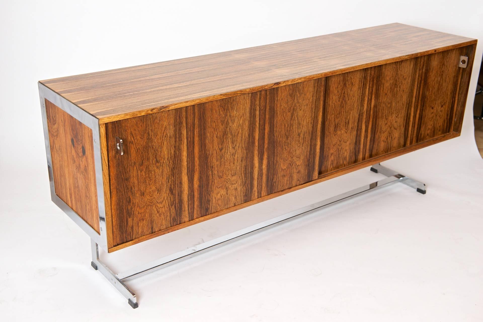 Richard Young for Merrow Associates sideboard.

Rosewood and chrome.

There is a glass top with this sideboard that is not pictured. It is in excellent condition