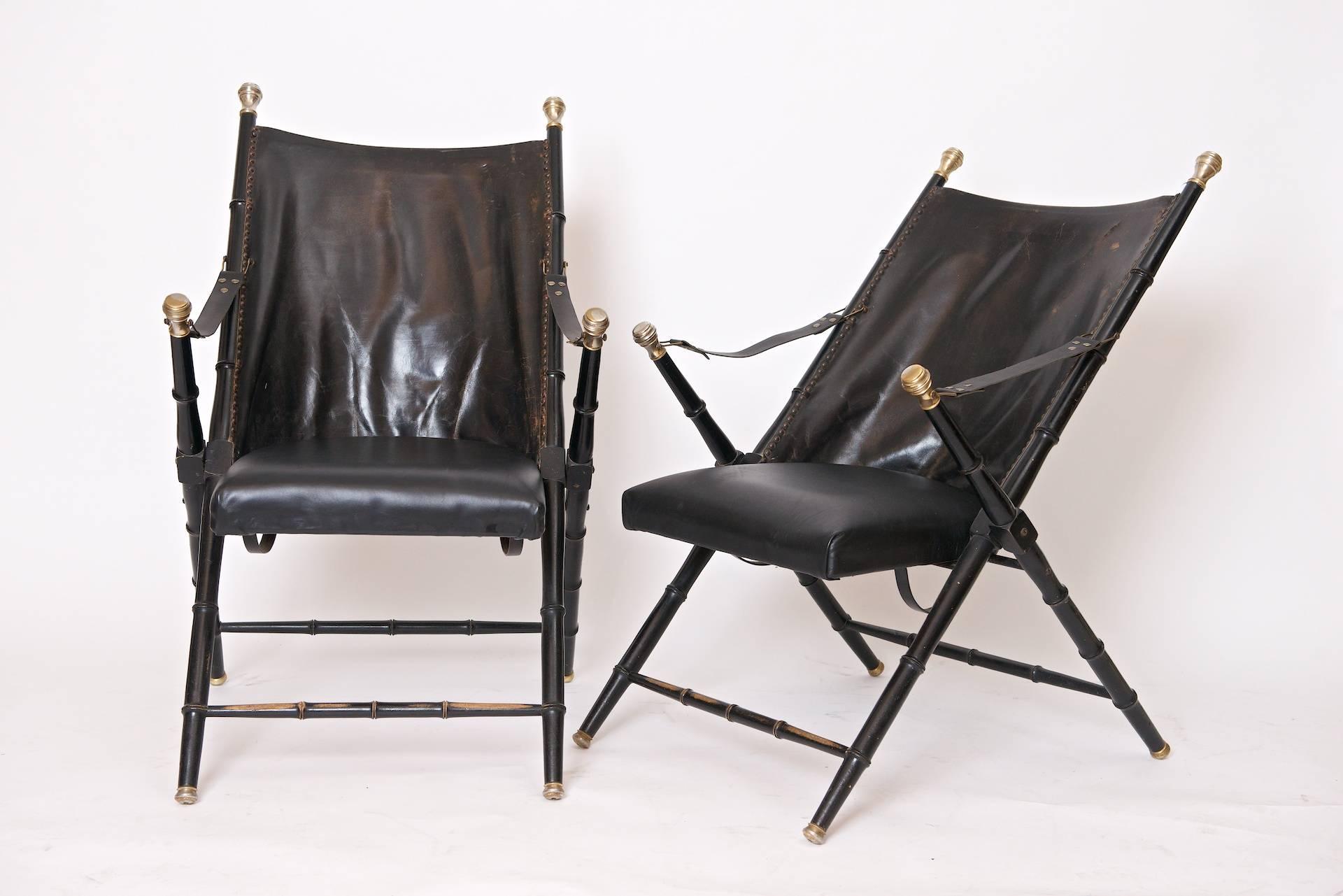 Pair of folding Campaign chairs by Valenti and made in Spain.

Leather, chrome and brass