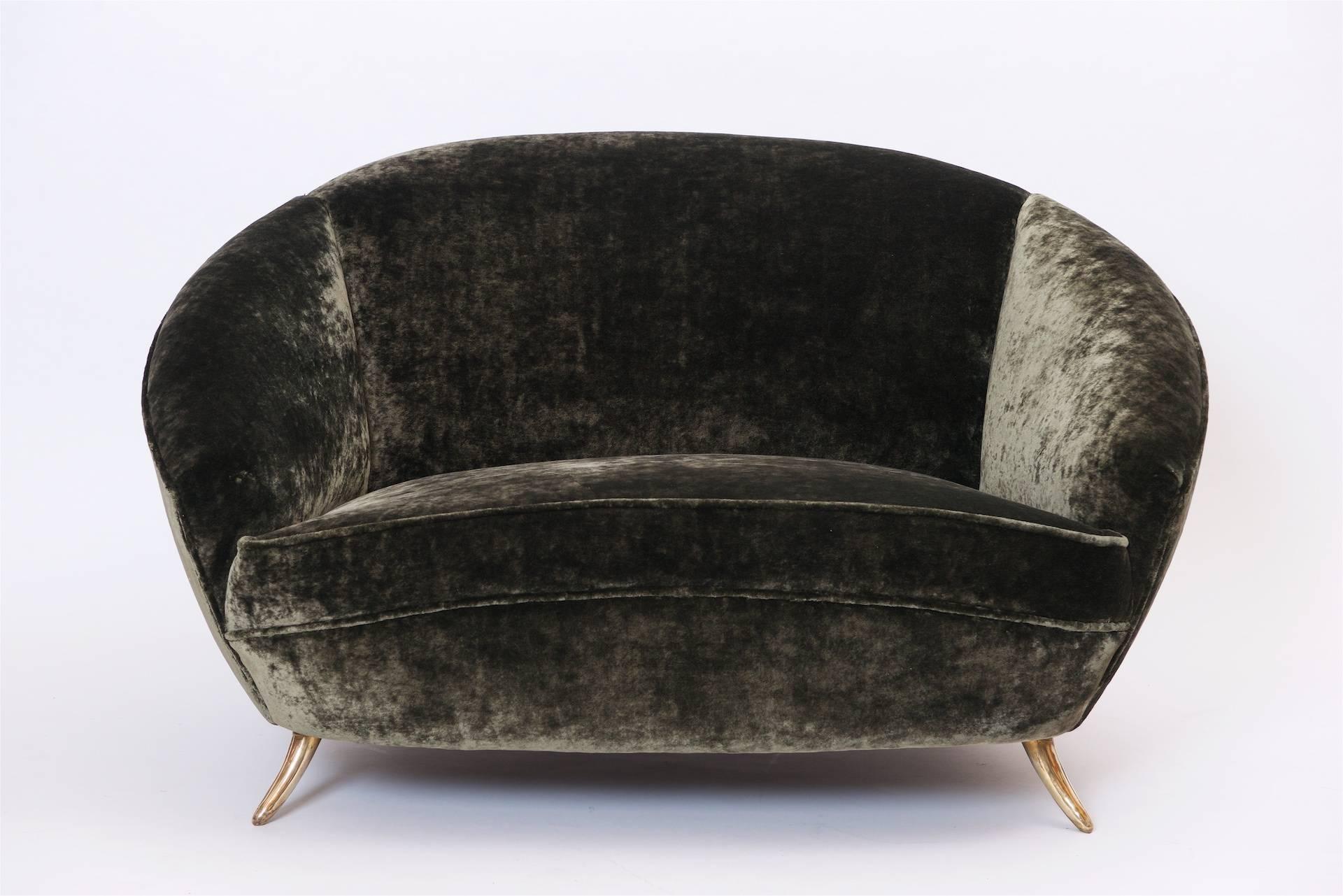 Curved Italian sofa from circa 1950 with brass feel.
Beautiful construction and quality.

The sofa has been re upholstered in velvet from The Royal Collection. 
Designers Guild. Olive.

Please note this is not a copy!!