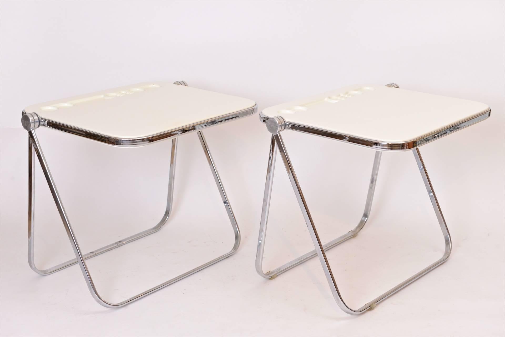 ** One available ** Folding writing desks designed by Giancarlo Piretti. 

Cream plastic with chrome folding mechanism.

Wonderful design for space saving.

Dimensions when folded.... 90cm x 82cm x 6cm

Selling individually. 

