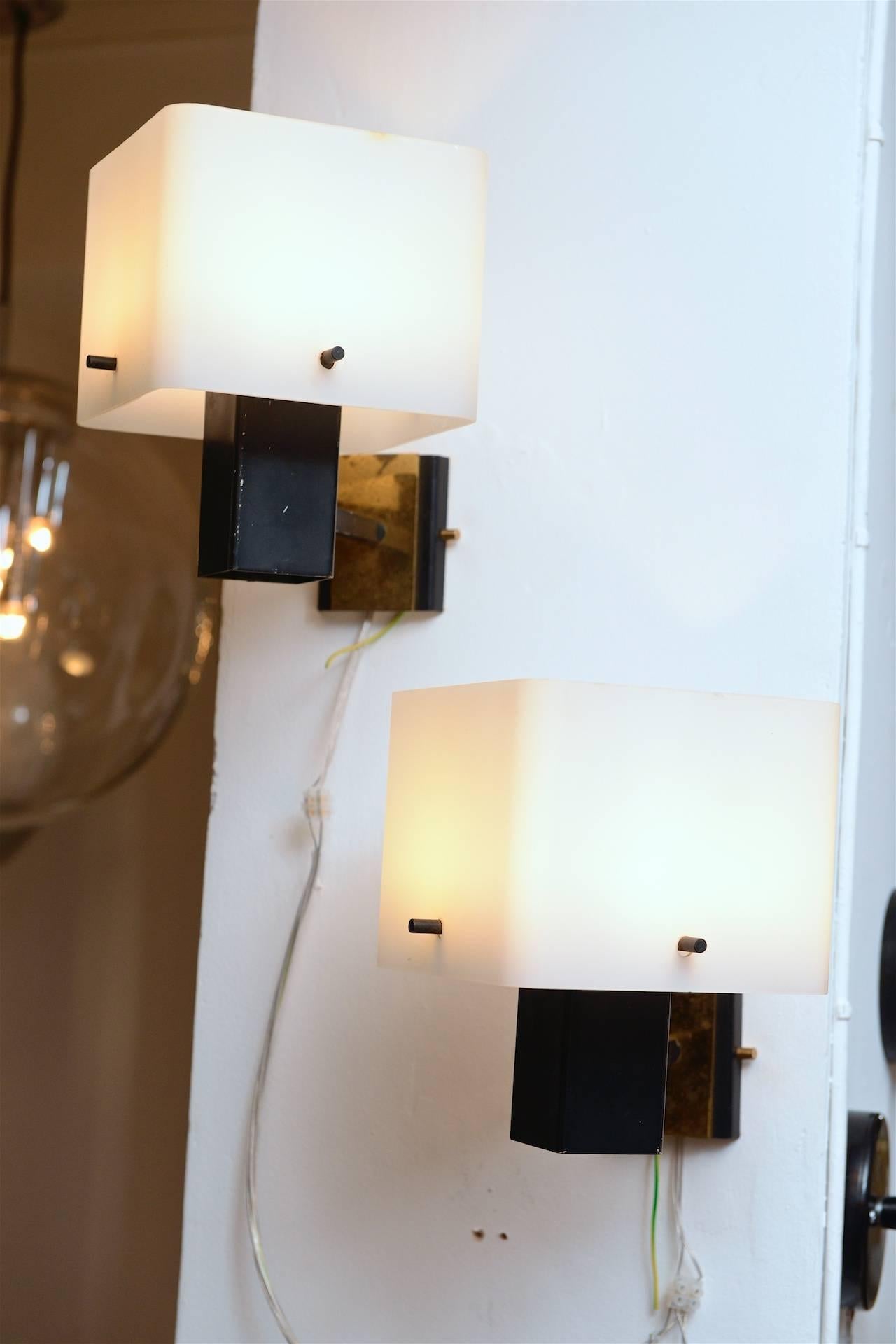 Stilnovo wall lights with opaline shades 

Square opaline shades at right angle to wall. Brass details.