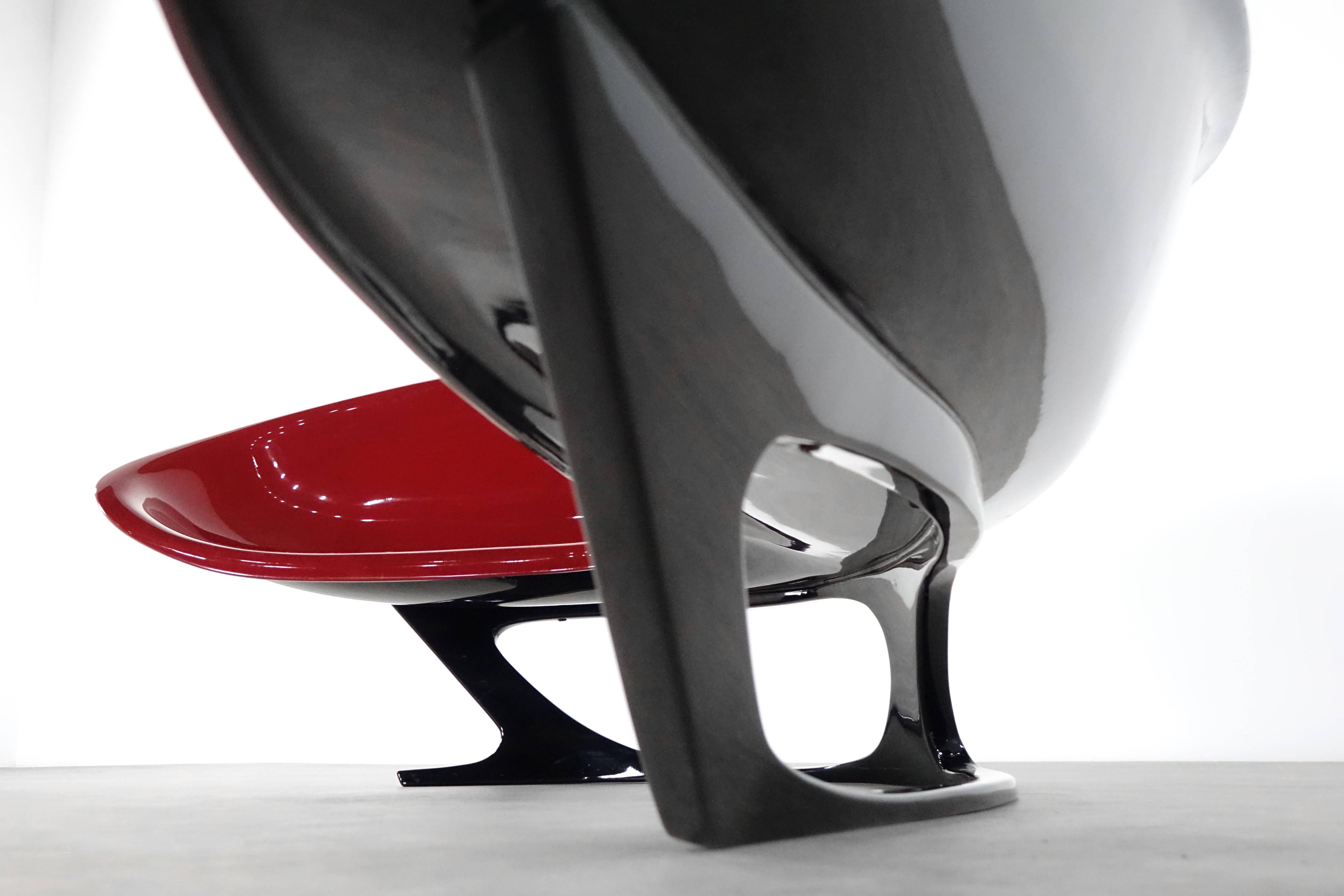 Stefan Sterf, rare 'Ecstasy' lounge chair, circa 1990, for Axel Zoellner-Geistert, Phoenix GmbH, Berlin. Manufactured by Axel Zoellner-Geistert, Phoenix GmbH, Berlin. Plastic seat in boomerang shape, dark red and black. Only a total of seven were