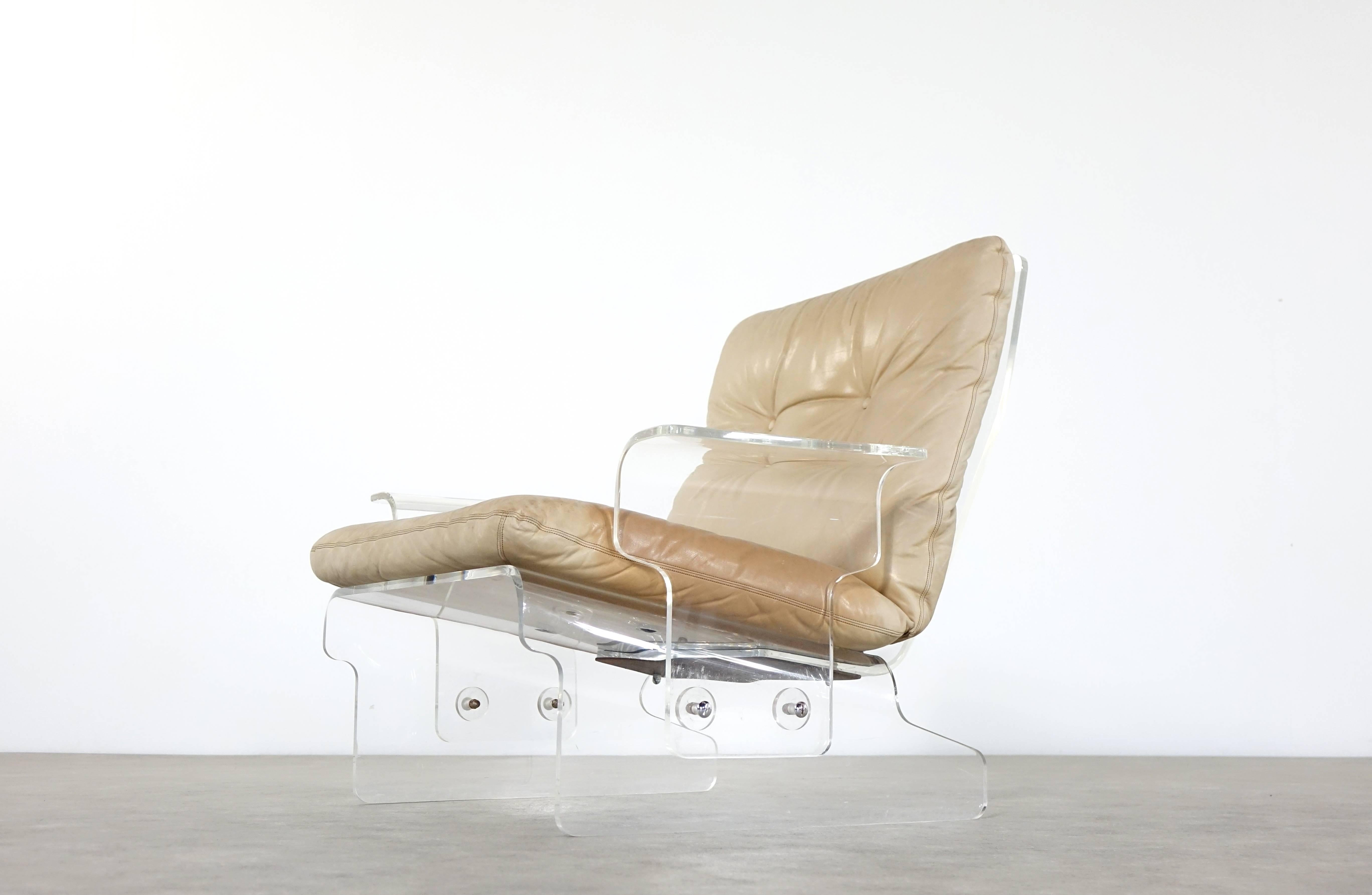 Two extremely rare 1966 lounge chairs by Baumann, Germany.
Highly comfortable! The acrylic parts are in very nice condition, no cracks, just some scratches with all these years.

The back and bottom cushions in nicely bleached cognac leather are