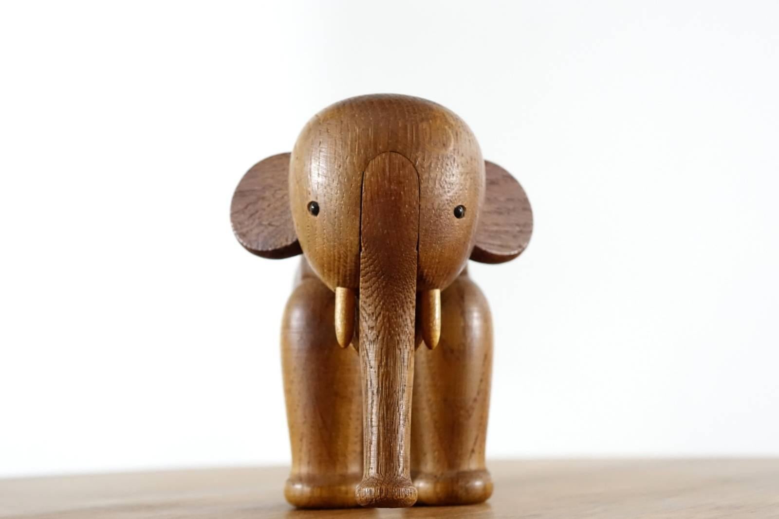 Solid oak elephant, with moveable trunk and legs. Marked on bottom of foot,
Kay Bojesen, Denmark, copyright.