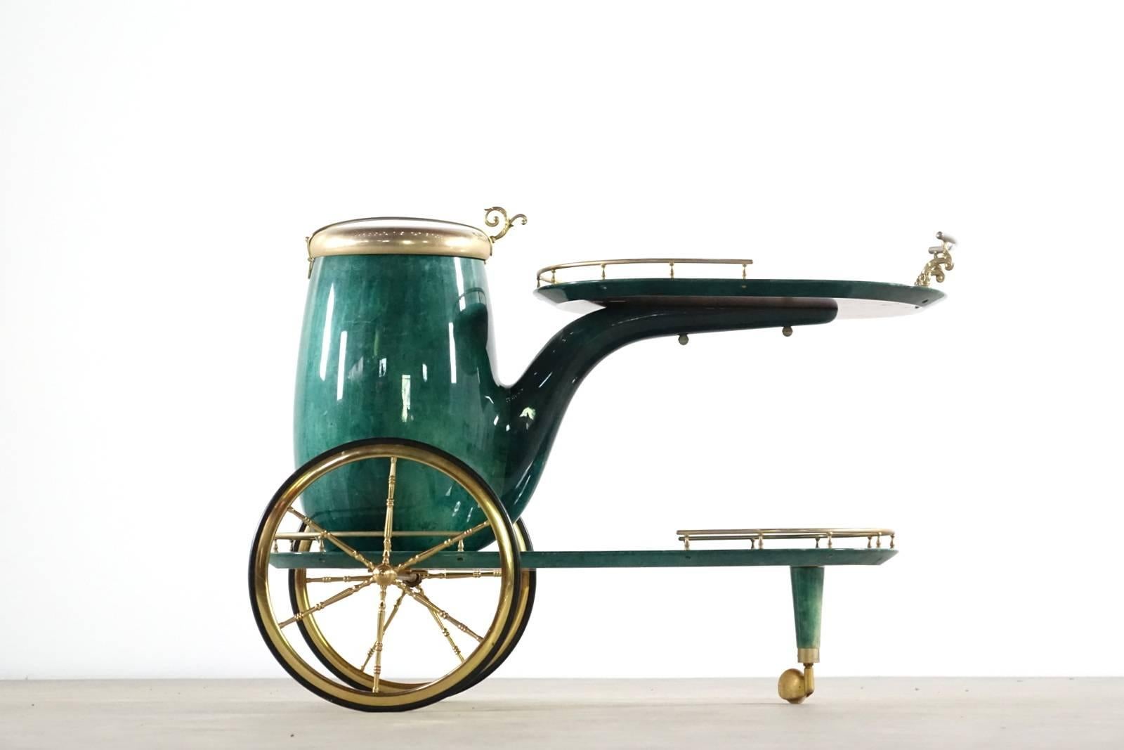 This stylized vintage bar cart features a unique pipe style ice bucket, lacquered goatskin finish and the creative Italian design of Aldo Tura.