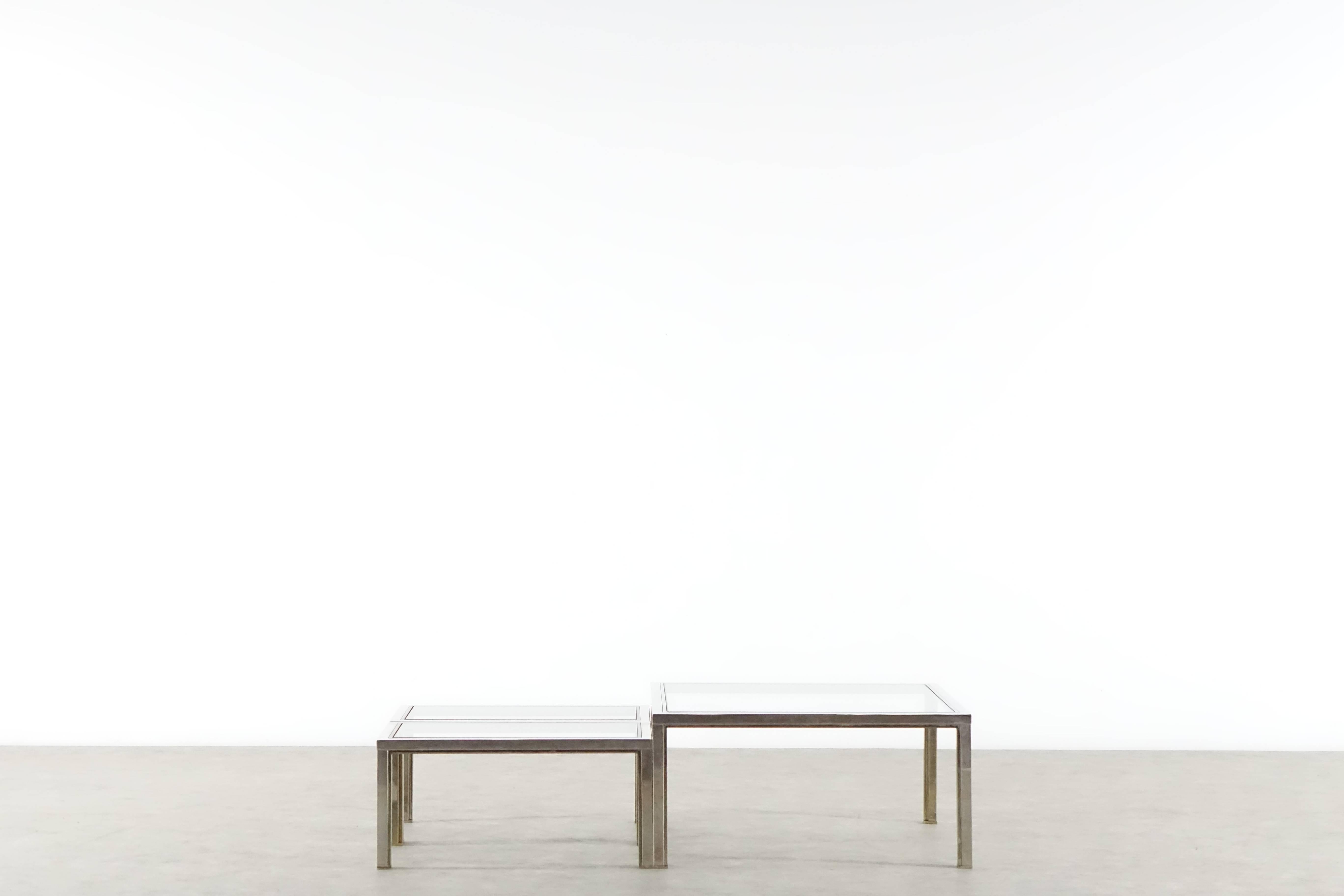 Clear and elegant coffee table and side tables made by Romeo Rega. 
Solid brass and chrome with a clear glass top.

Dimension:

Coffee table: 88 cm x 88 cm wide / deep 43 cm high.

Side tables: 76 cm wide 43.5 cm deep 36 cm high.
