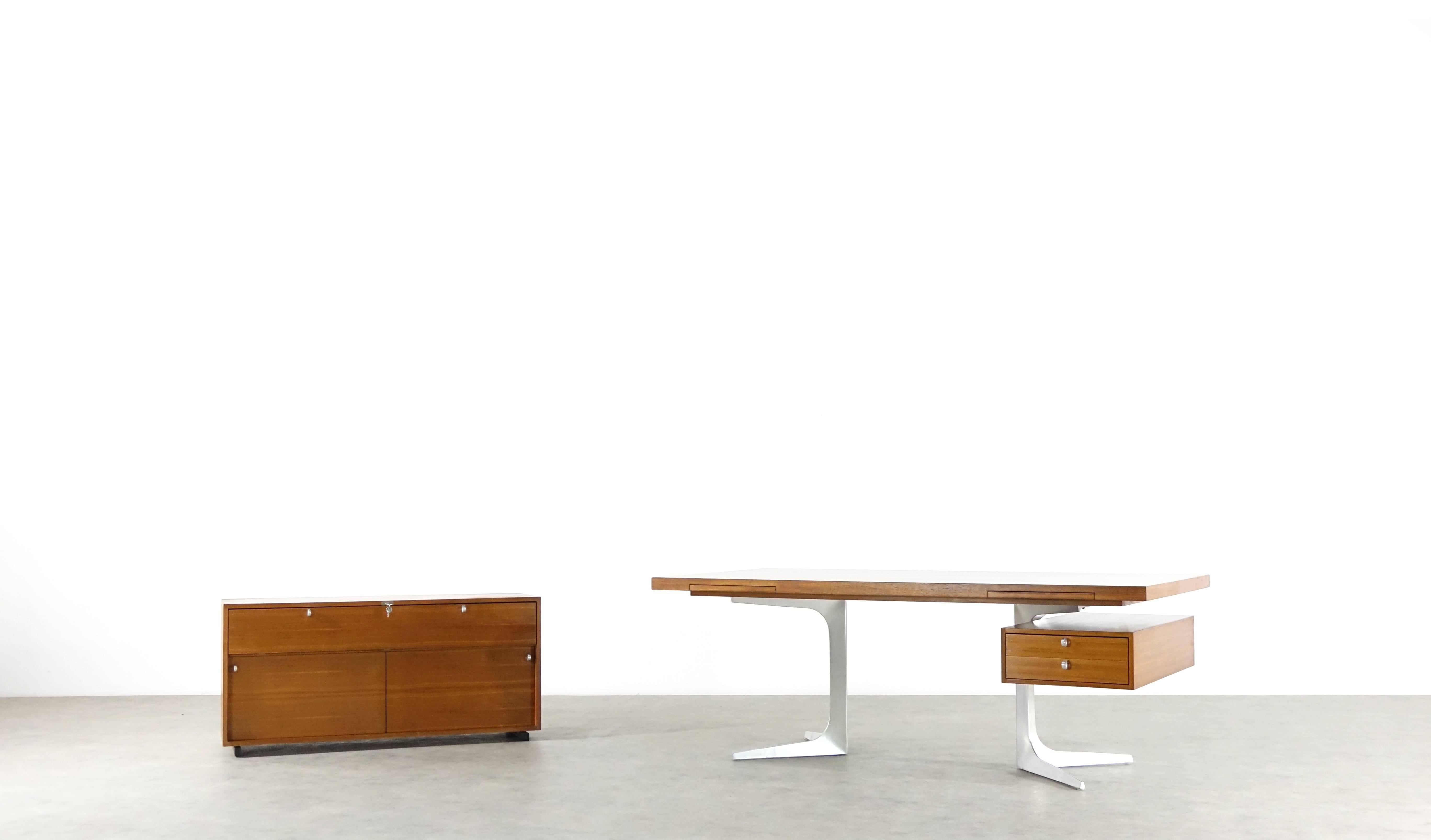 Herbert Hirche, executive office sideboard from top series by Christian Holzäpfel designed, 1967. Teak surfaces also on the rear side of the container. Original key included. Measures: Width 133.5 cm, height 63 cm, depth 48.5 cm.

Literature: