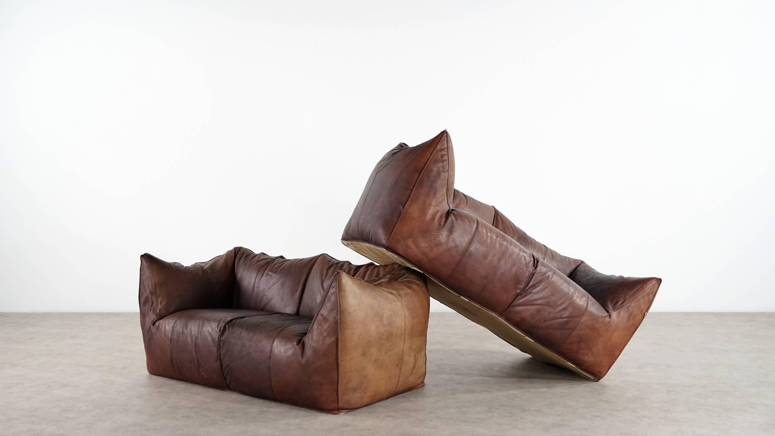 Vintage two-seat sofa “Le Bambole” by Mario Bellini for B & B Italia. Manufactured in Italy during the 1970s. Really comfortable sofa in original thick chocolate neck leather. Almost 40 years old, but the sofa remains in good condition with traces