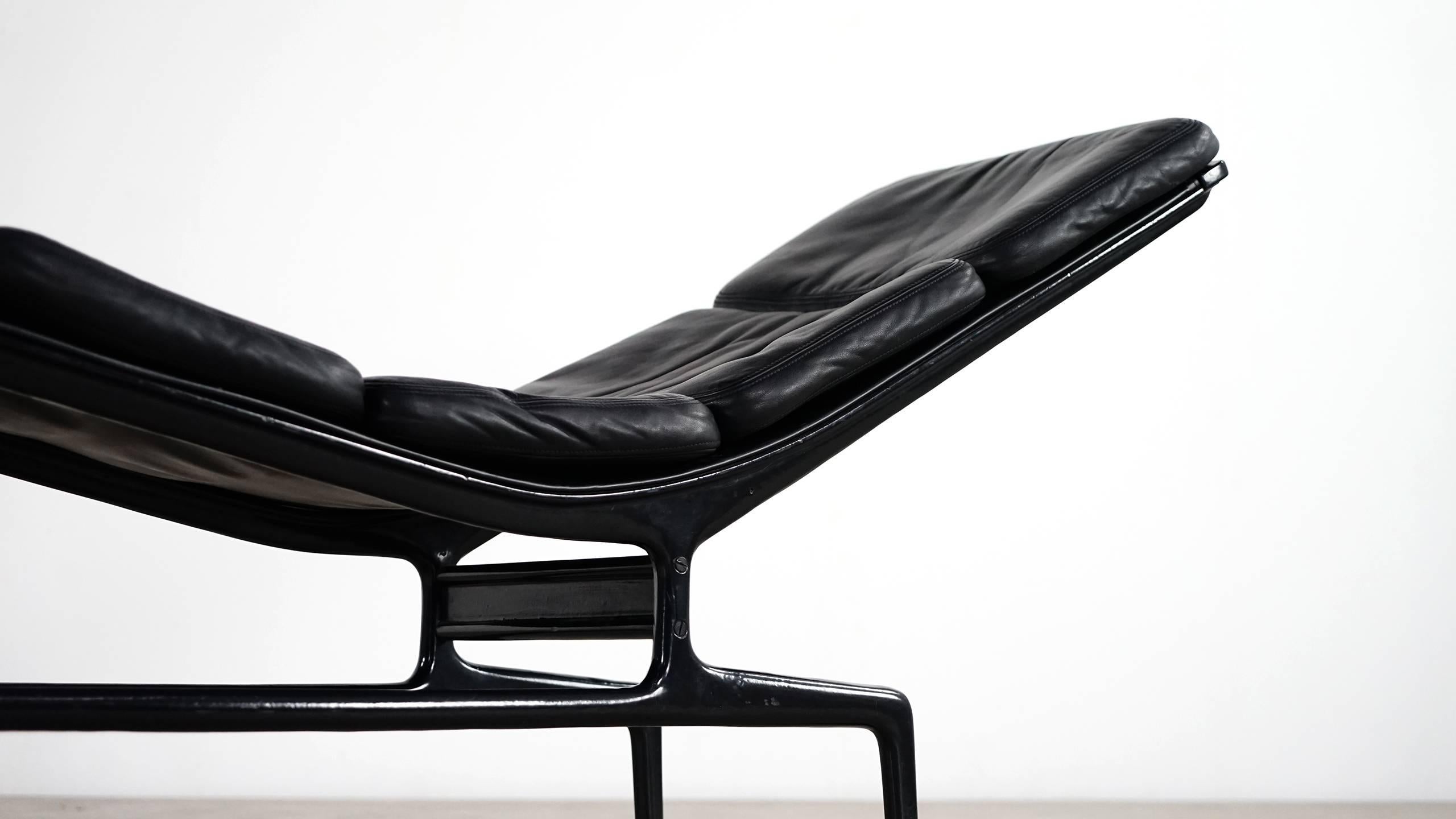 Minimalist and modernist Charles Eames chaise in black for Herman Miller, designed in 1968 for filmmaker Billy Wilder. 

This is an early production Eames chaise with black leather cushions on a black die-cast aluminium frame. The chaise features