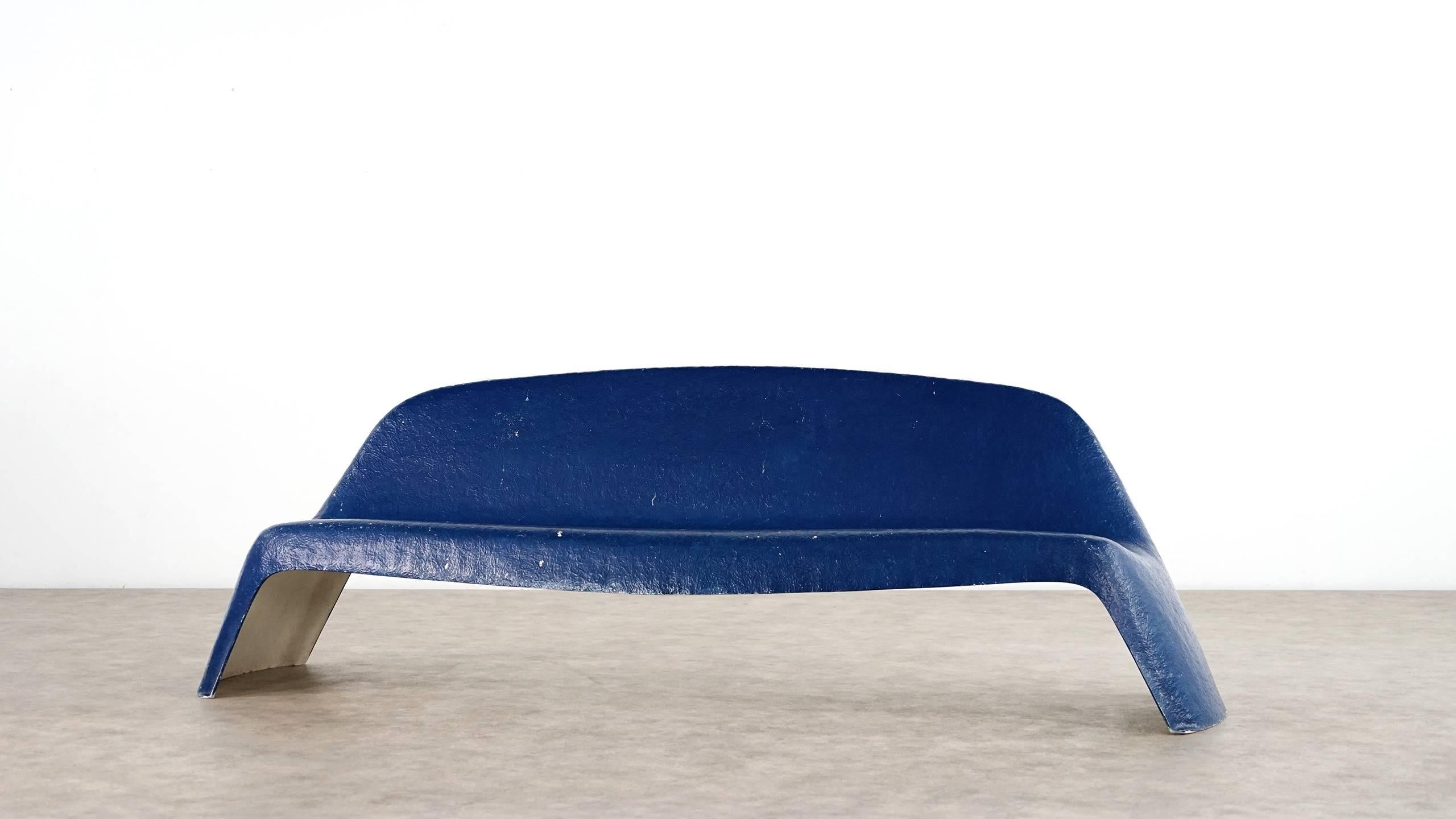 Garden bench designed in 1967 by Walter Papst, manufactured by Wilkhahn.

The bench is made of a single piece of laminated galls fiber plastic with a beautifully visible structure and is a great example of the space age design of the 1960s. 
Made