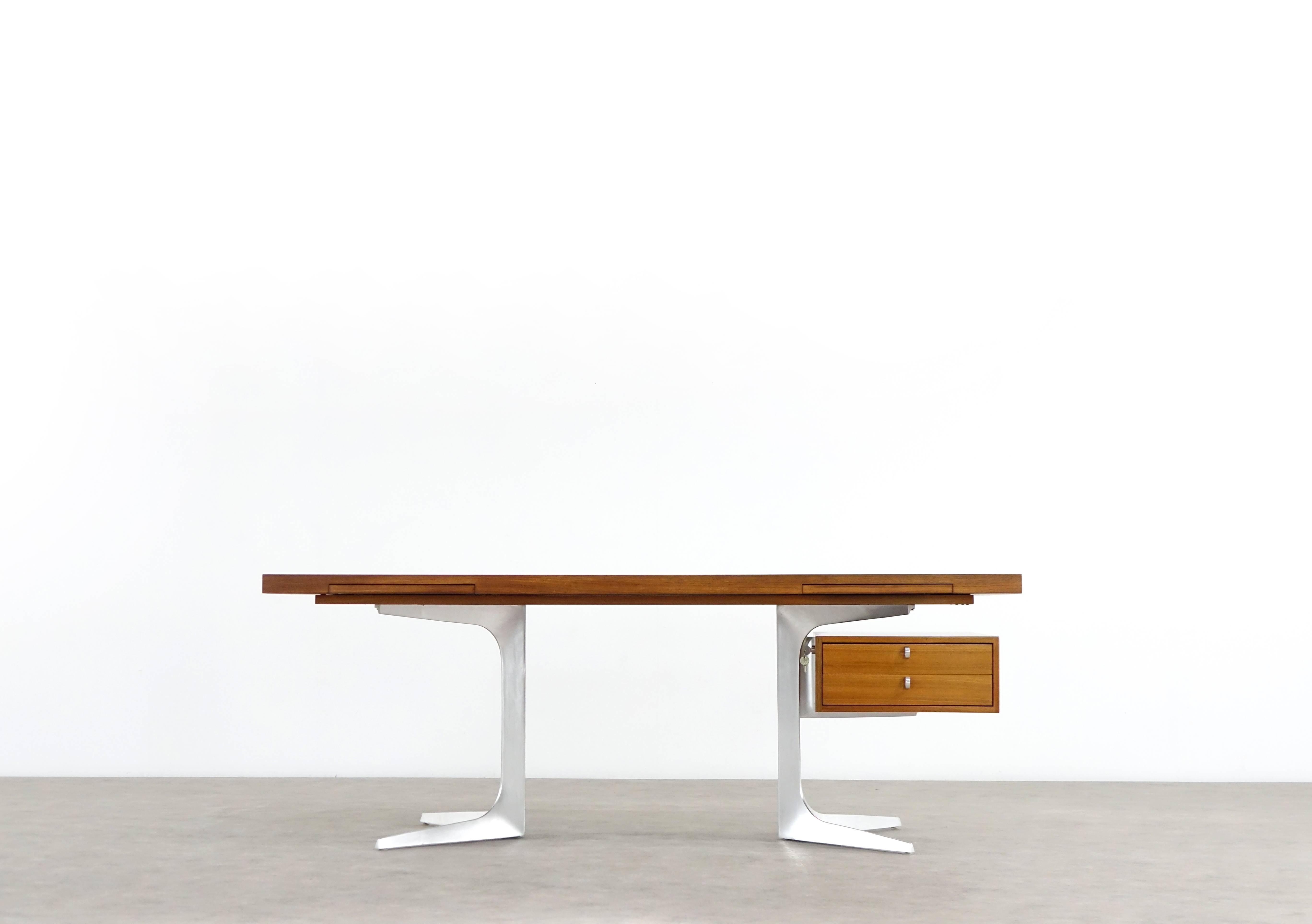 Herbert Hirche, executive writing desk from top series by Christian Holzäpfel designed, 1967. Lightly organically shaped cast aluminium lower frame, teak surfaces on tabletop and container. This piece has been carefully restored and is in perfect