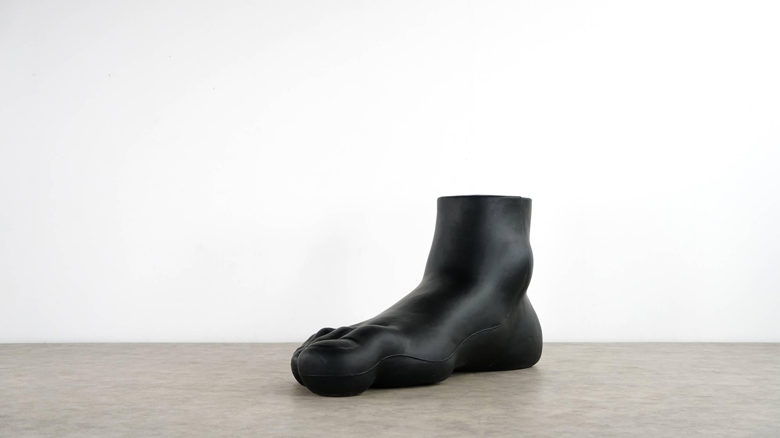 Designed by Gaetano Pesce in 1969 for B&B Italia 

The legendary "UP-7" Foot is made of flexible cold-shaped polyurethane foam with a smooth and flexible black coating. 

Not only an expressive sculpture, but also a real lounge