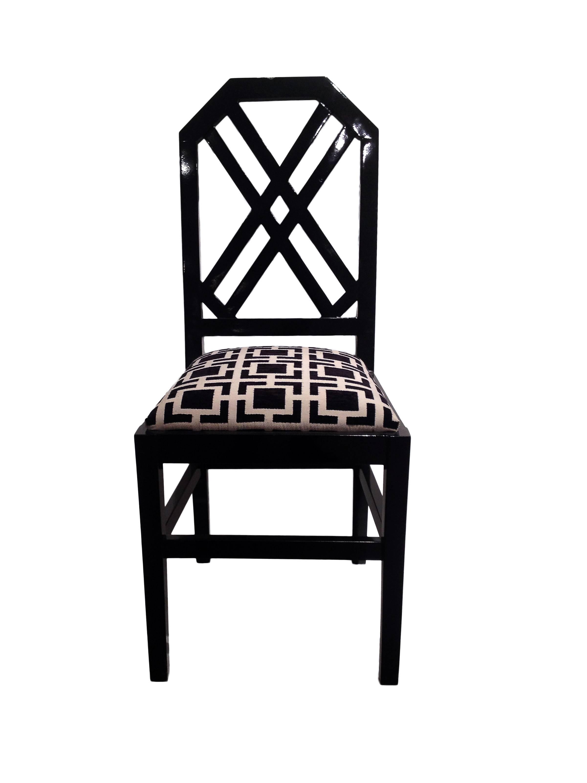 Inspired by the Chinese Chippendale style this set of chairs bring to mind the great interior designer David Hickx not in the least because of the black and white geometric upholstery.