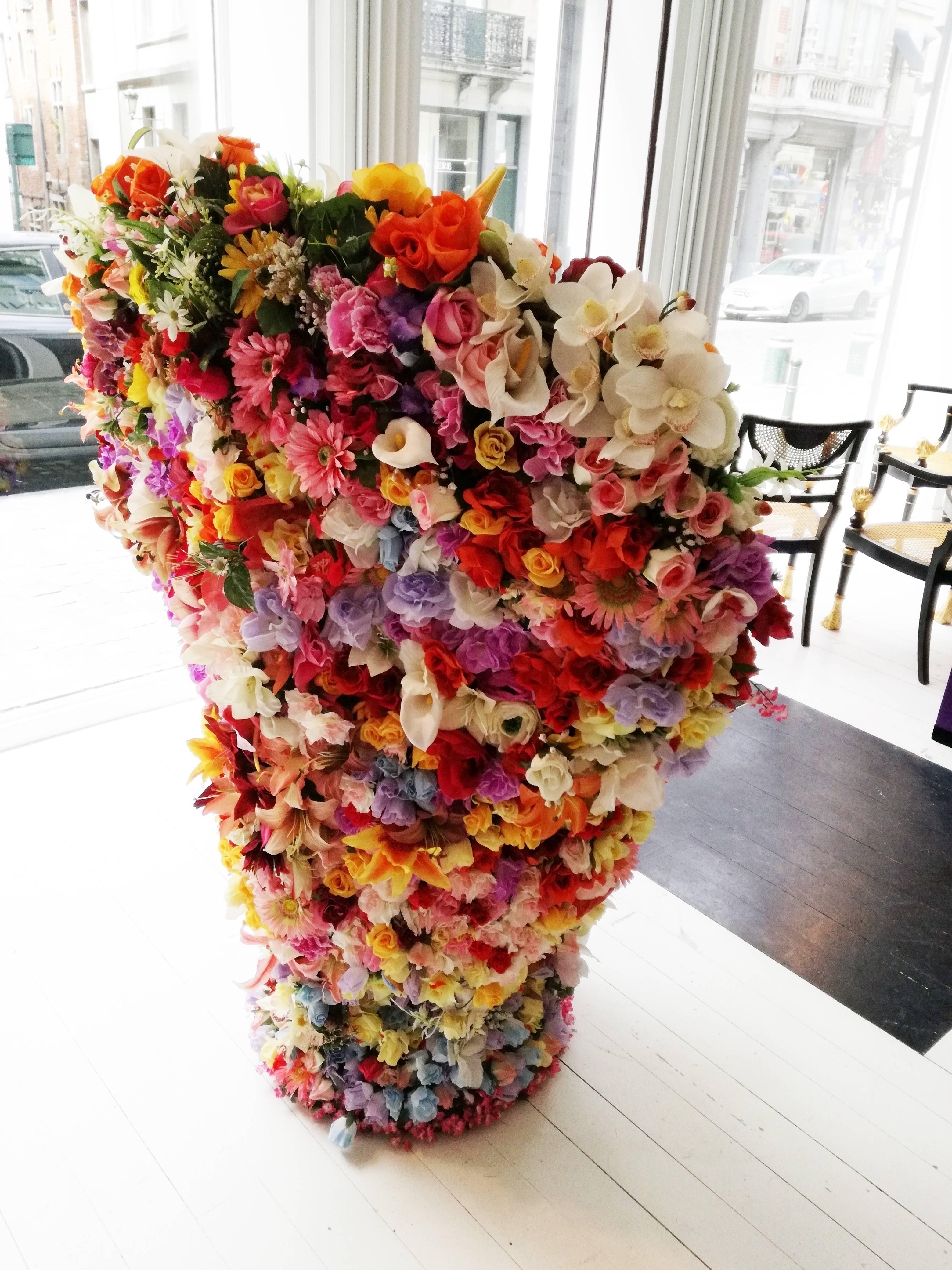 This unique piece is the work of Belgian artist Michel Marcy it has been made of a wicker support and hundreds of artificial flowers made of fabric.