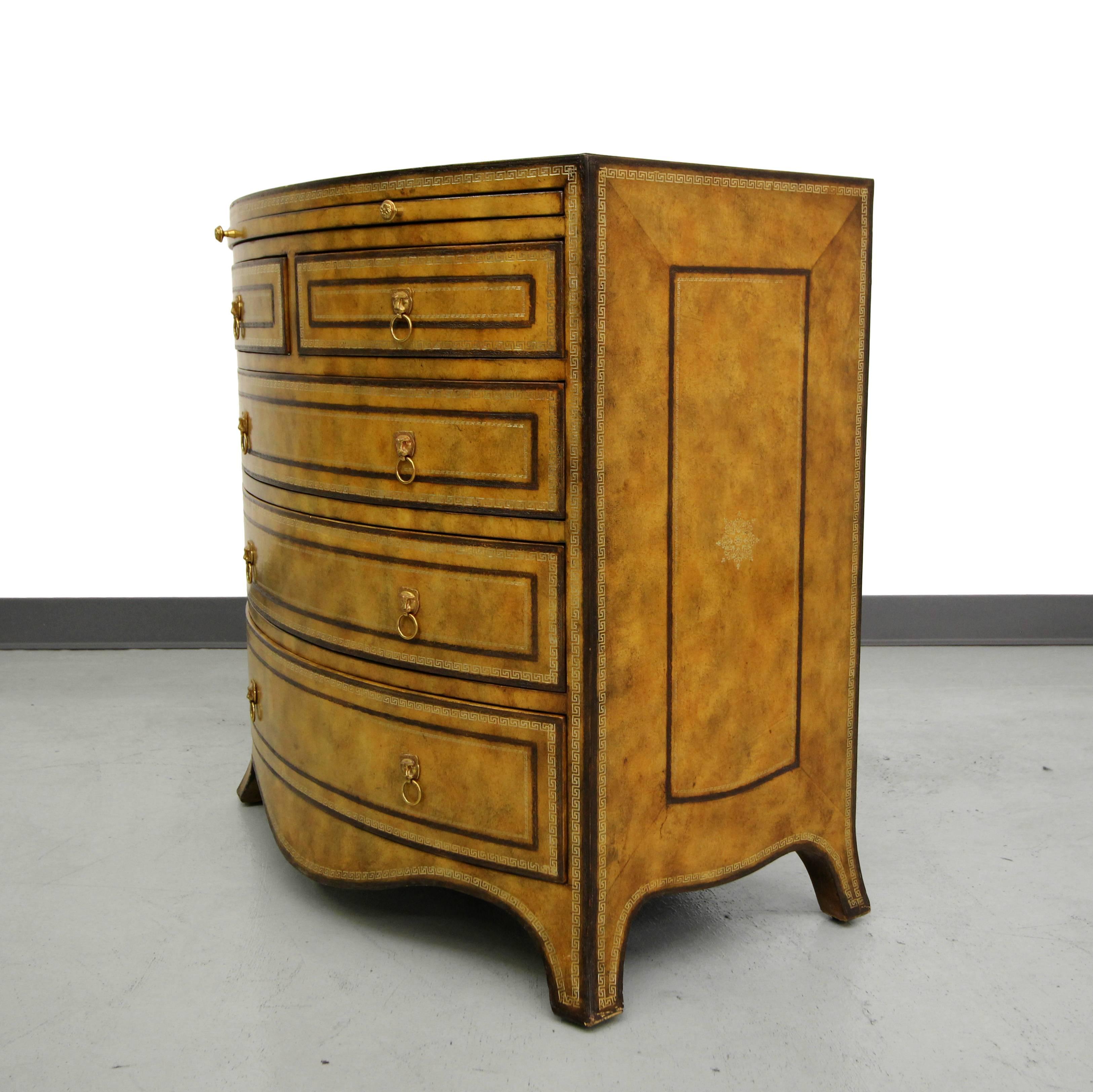 This petite bow front, leather covered chest is a gorgeous example of Classic Maitland-Smith craftsmanship. Would make the perfect entry chest or oversized nightstand.

Chest is covered in leather, with painted details and brass lions head drawer