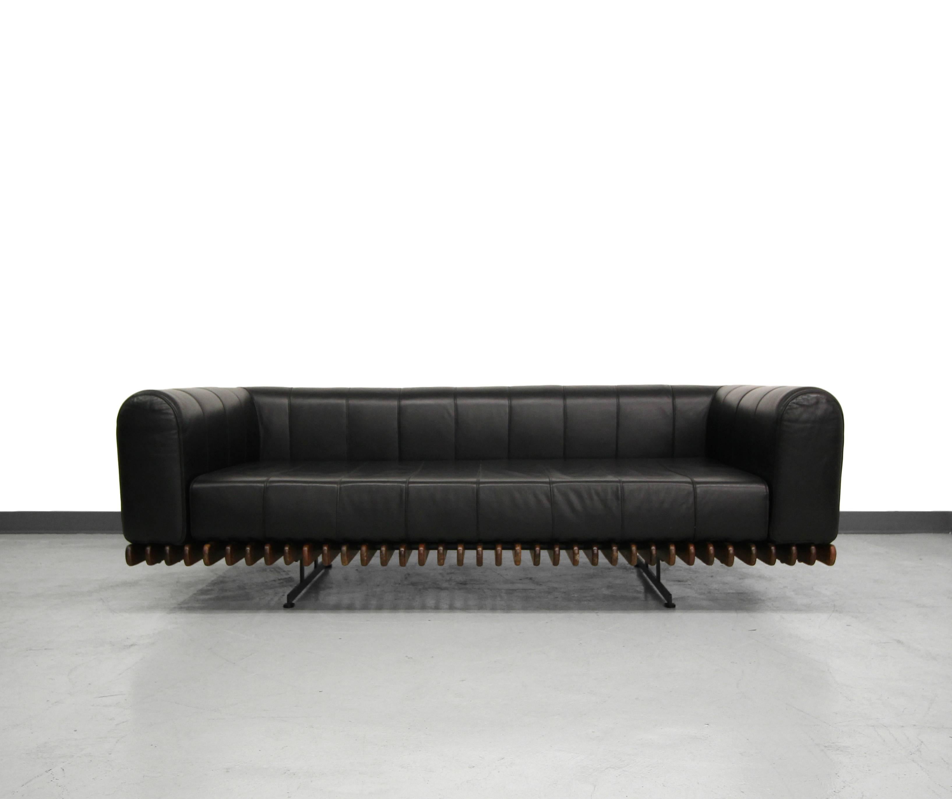 Pacific Green's low profile channeled leather sofa. Constructed out of beautiful palmwood and beautiful, butter soft A-grade, leather floating on a steel frame. Gorgeous piece exhibiting both form and function.

Pacific Green is a sustainable