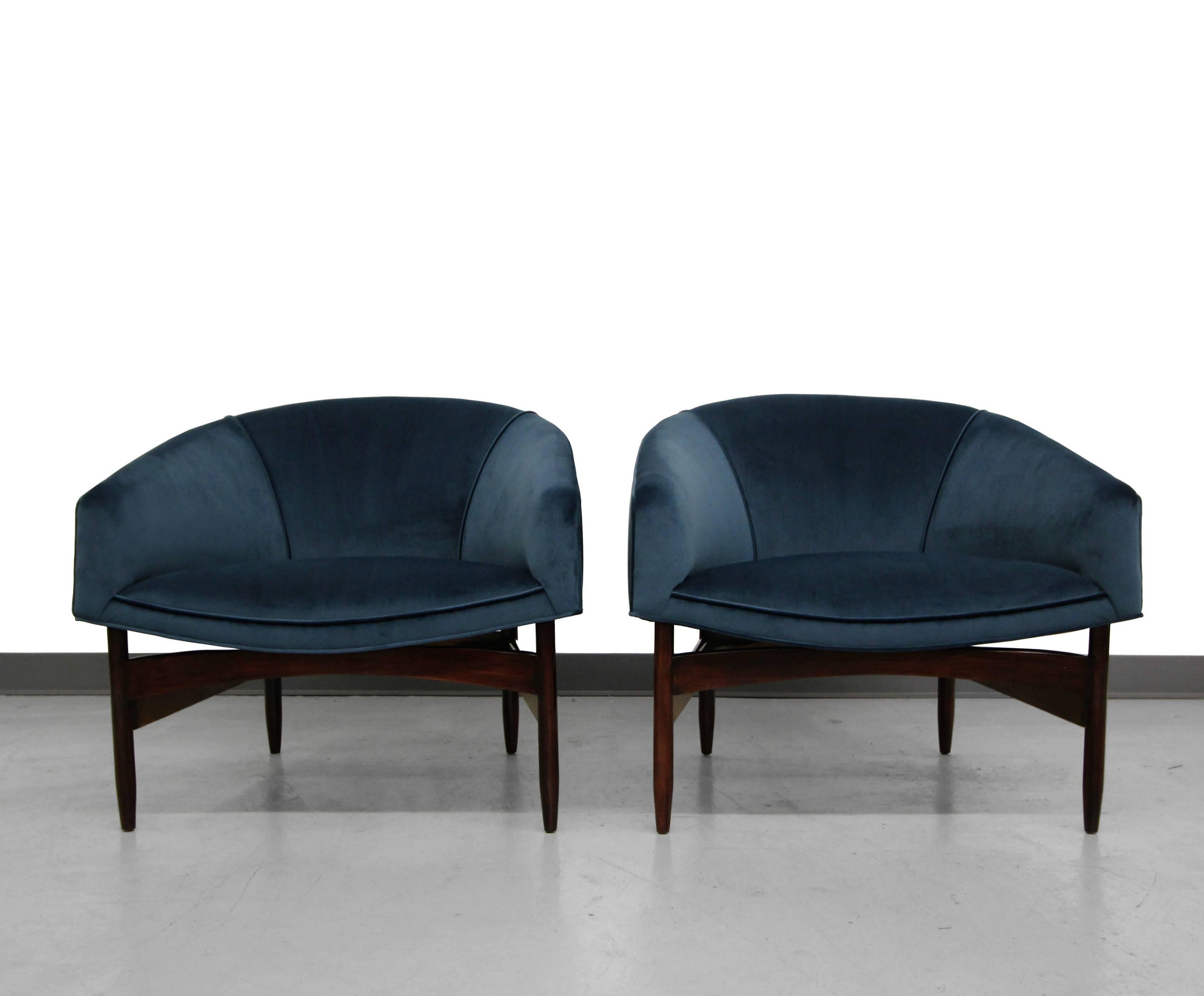 Perfection in a pair of chairs. Designed by Lawrence Peabody, this pair is ideal. Everything about these chairs is perfect. Gorgeous barrel backs, new dark teal, blue velvet upholstery and sculpted wood bases. These are so Classic they will mesh in