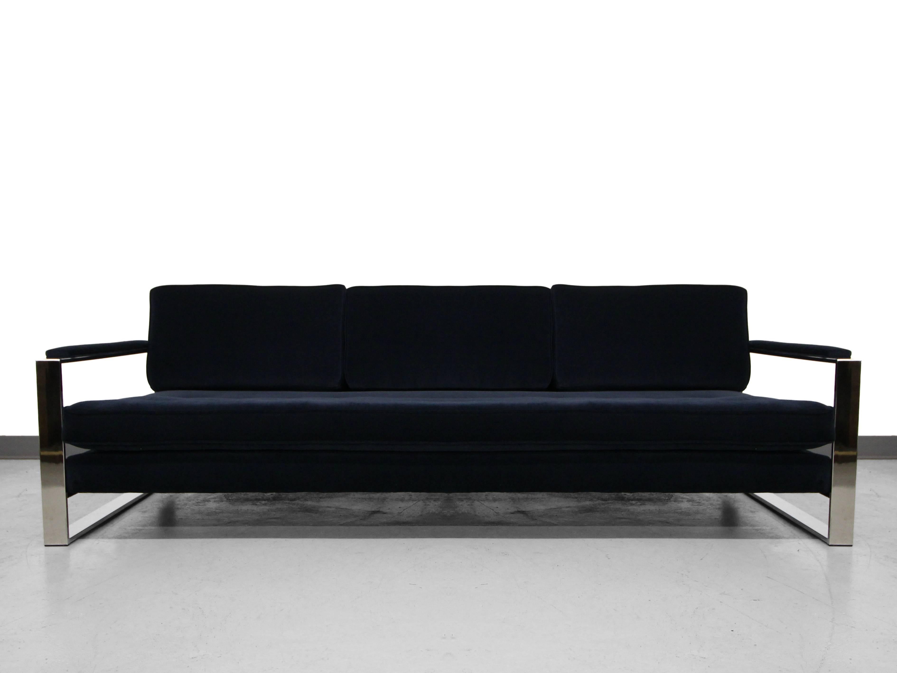 A perfect floating chrome Mid-Century sofa, Milo Baughman. Floating on a mirrored chrome frame and dressed in a dark navy crushed velvet, this is one classy sofa.

**Matching pair of chairs also available in a separate listing, see last image.