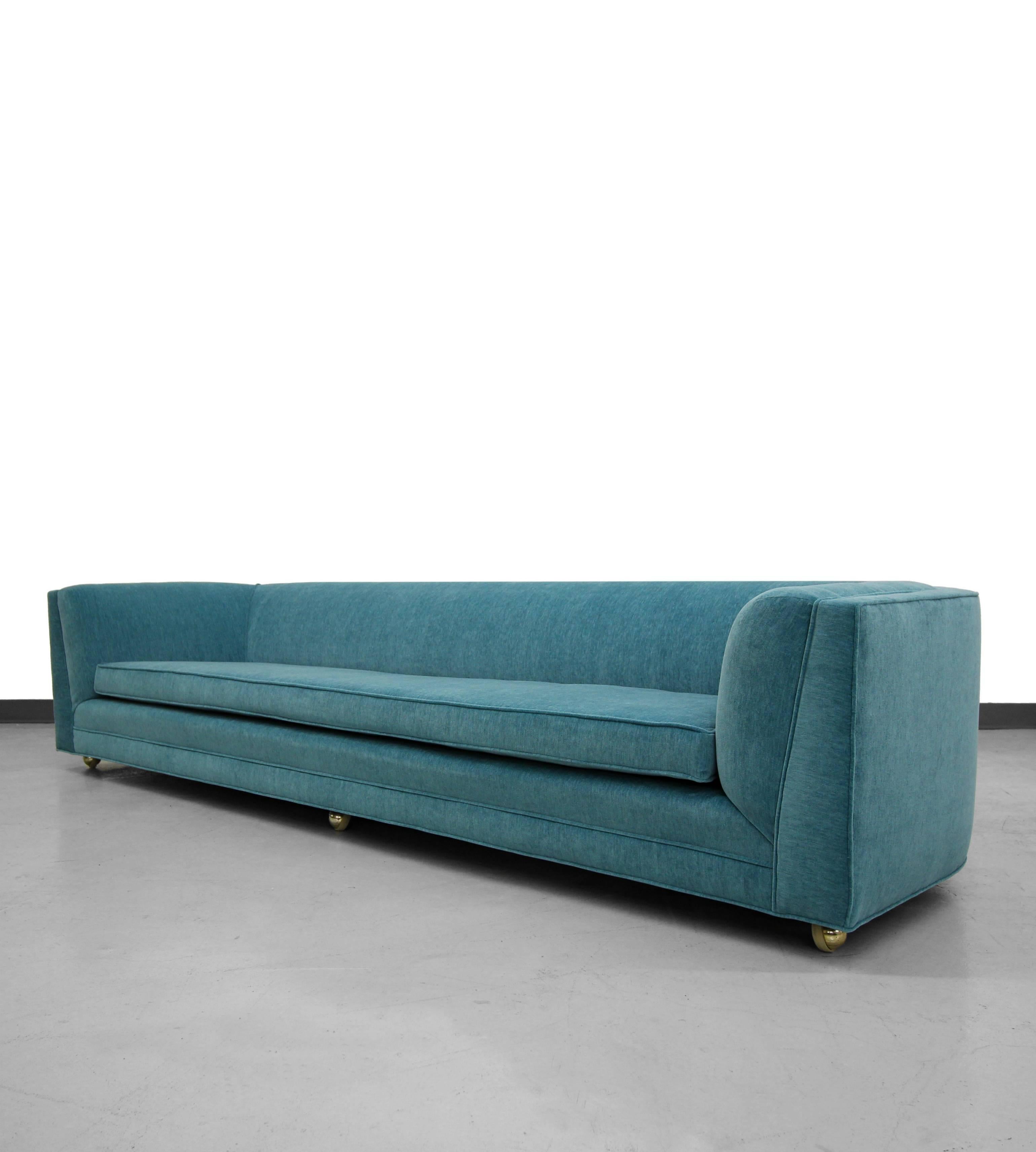 This is an absolute show stopper of Mid-Century sofas, 8 Ft. If you've been looking for that perfect long lean sofa to fit your space this beauty will not disappoint. Her lines and curves give her mass appeal and her perfectly rounded backside give