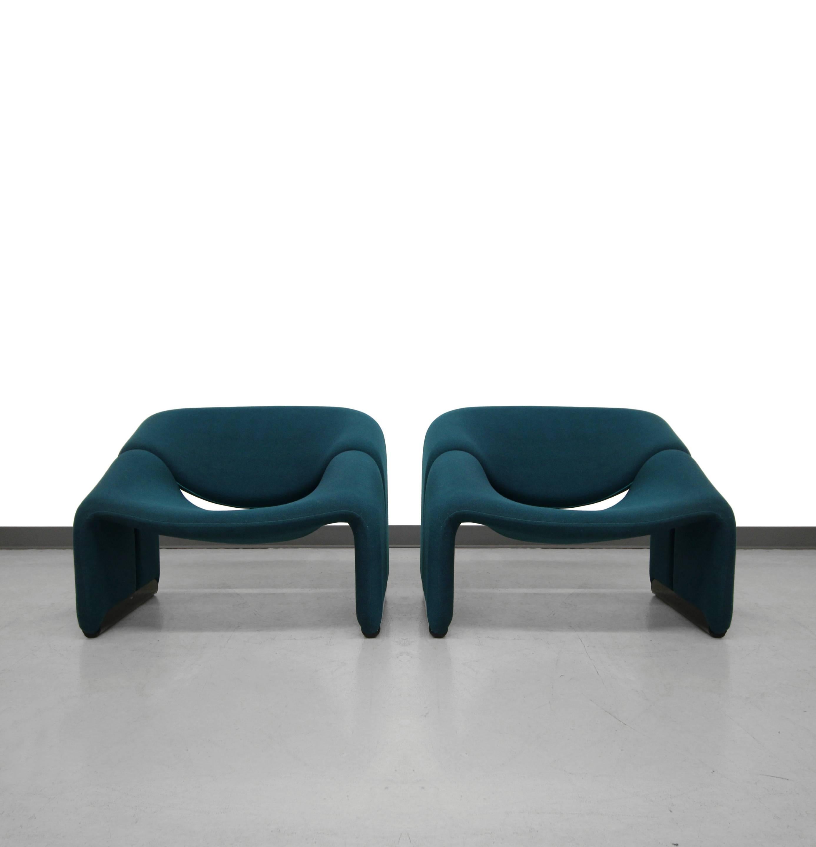 All original pair of F598 groovy chairs by Pierre Paulin for Artifort. Chairs have original dark teal tweed upholstery and black metal floor glides. They are in excellent all original condition. A rare find indeed.