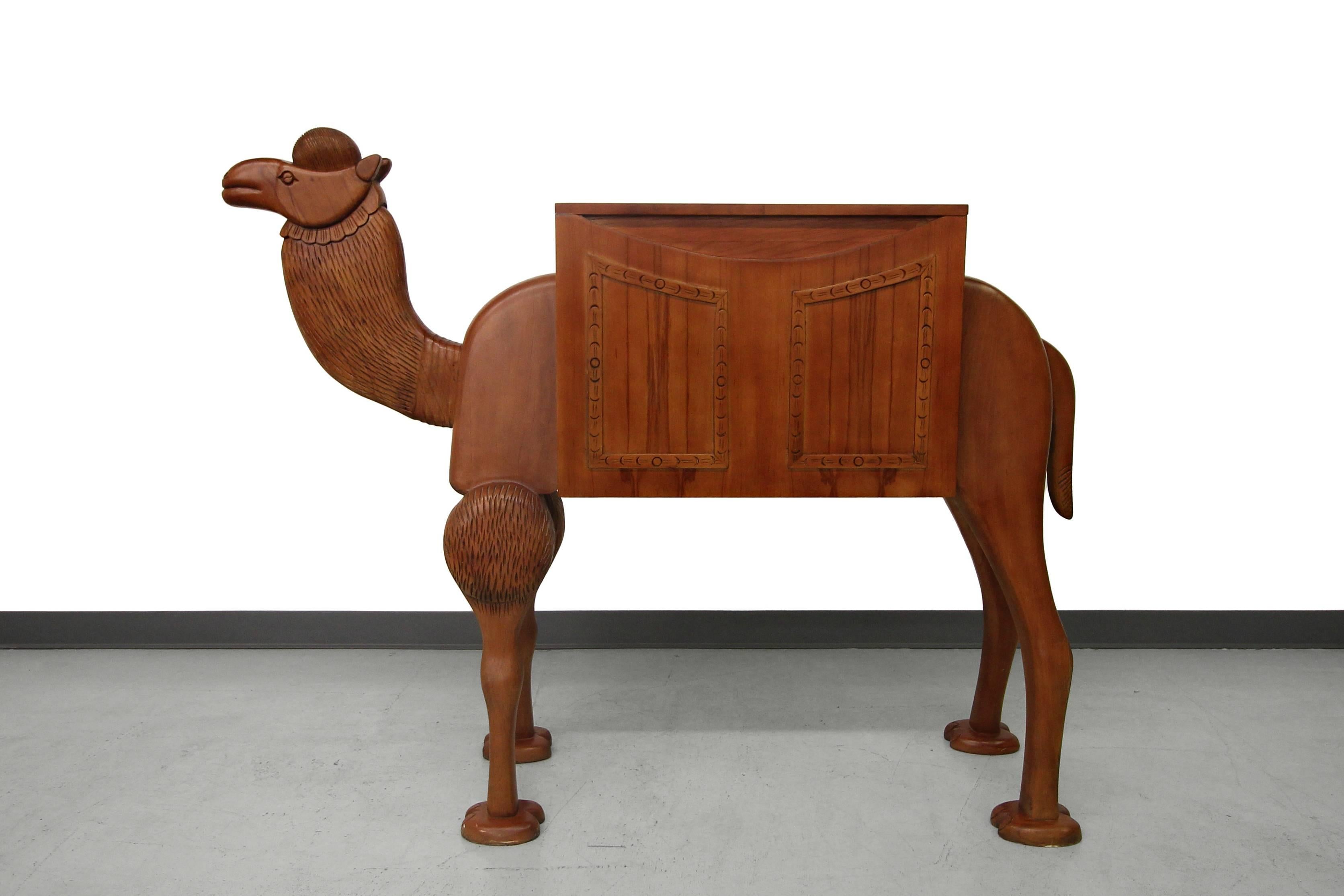 This is a conversation piece for the ages. It is a camel cabinet from Turkey. It could be used as a bar, liquor cabinet or merely as decor. The camel and cabinet feature beautiful hand-carved details. Looking for that one eclectic piece that speaks