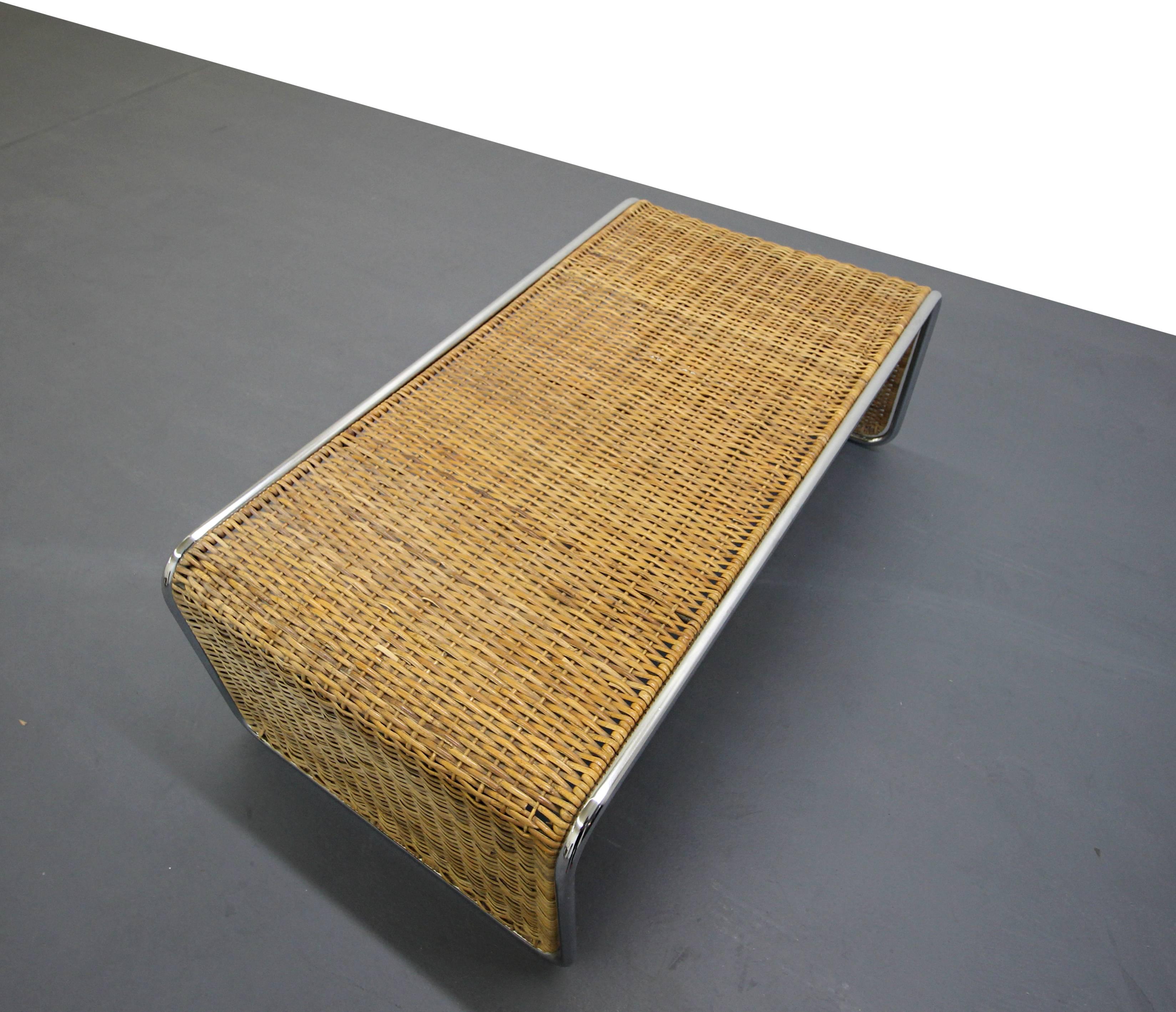Unique Mid-Century woven bamboo and tubular chrome waterfall coffee table. This table has a very eclectic, Bohemian, bungalow feel to it. Can't find another like it. Looking to add a bit of a textured, natural element to your space, this guy is