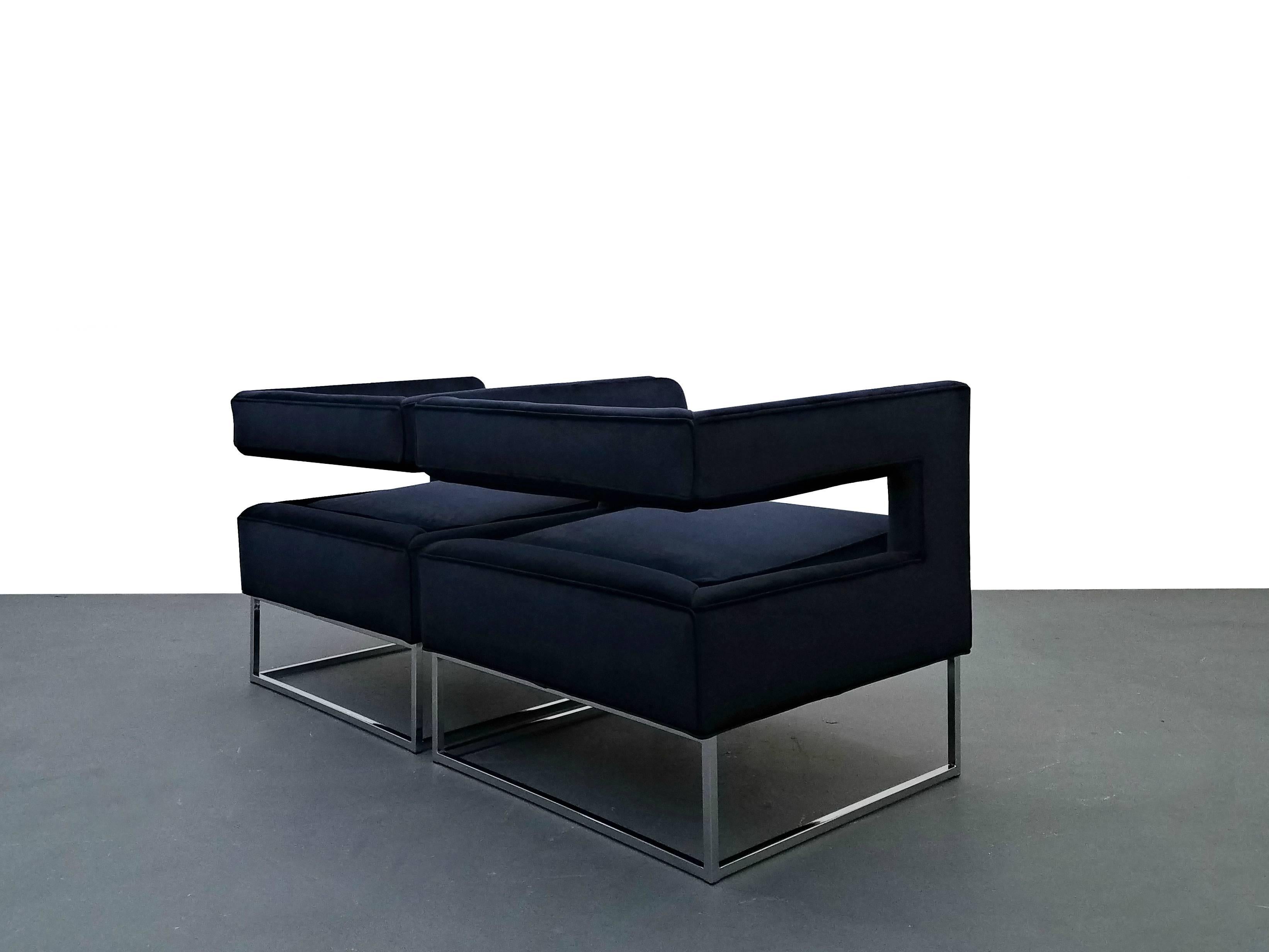 Pair of Mid-Century cube chairs made by Flair in the style of Milo Baughman for Thayer Coggin. These chairs are stunning, minimalistic beauties. 

They have been completely updated, reupholstered in a gorgeous navy blue velvet, chrome is near mint.