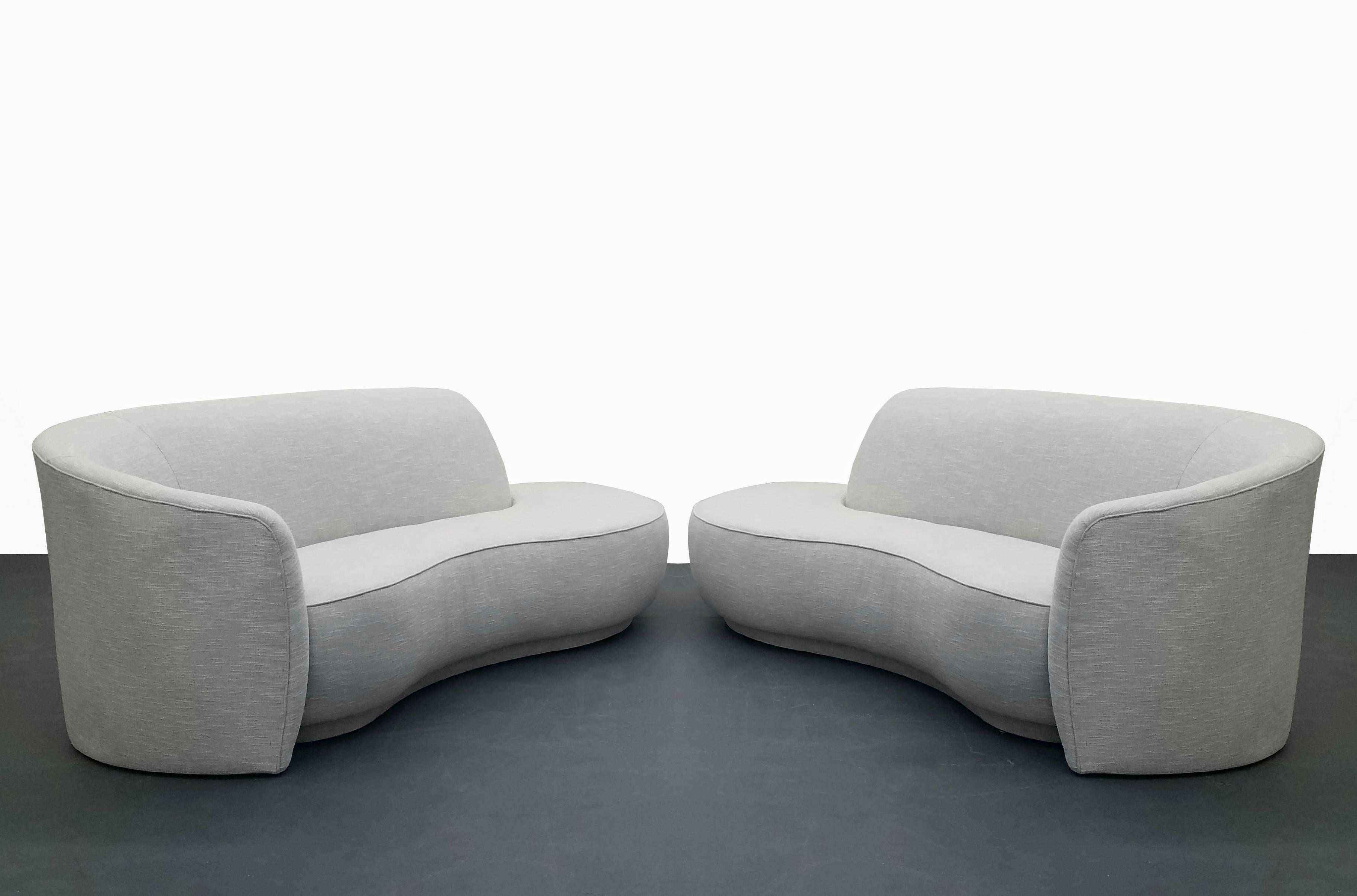 Completely restored pair of serpentine style sofas, style of Vladimir Kagan for Weiman. Been looking for that perfect pair, look no further. Sofas have been dressed in a beautiful neutral off-white colored chunky tweed. They are perfect and ready