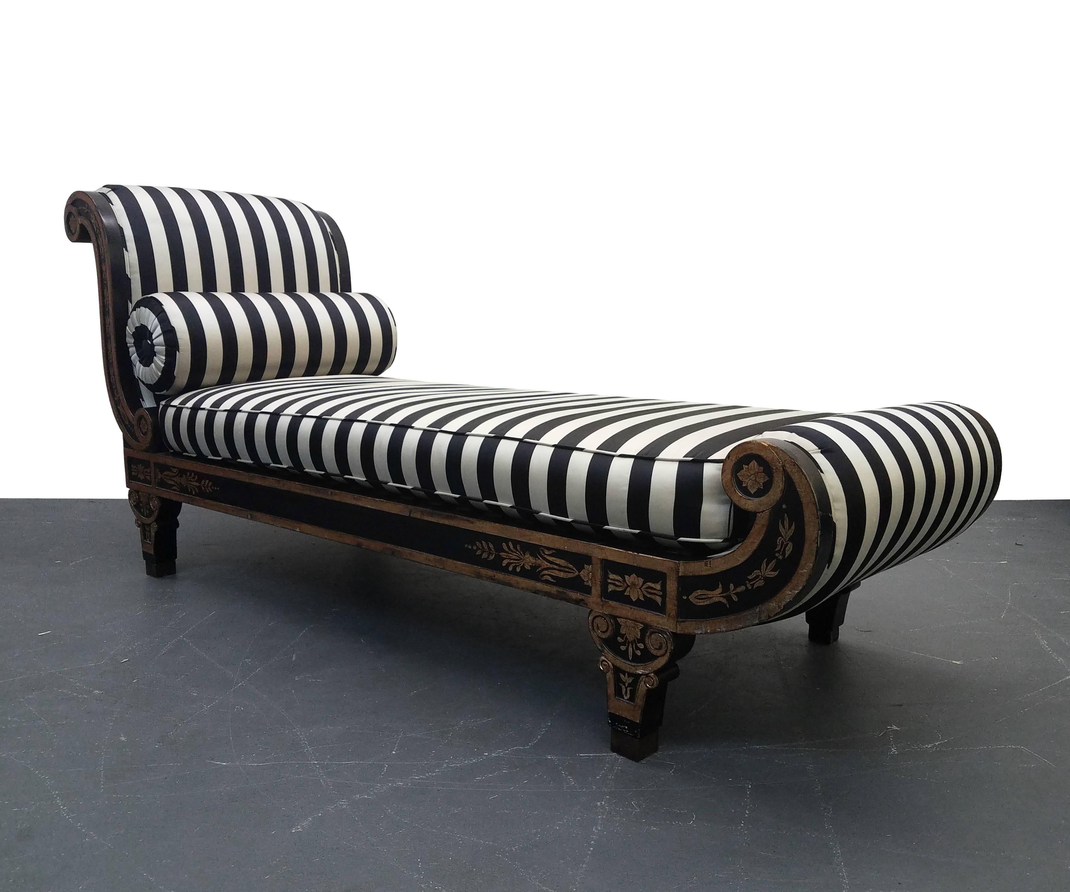 Regency style Cleopatra chaise longue chair. Framework is black with gold leaf detailing with black and white stripe sateen fabric.

This is a beautiful piece, a real standout. The perfect piece for your boudoir or Regency inspired space. Would