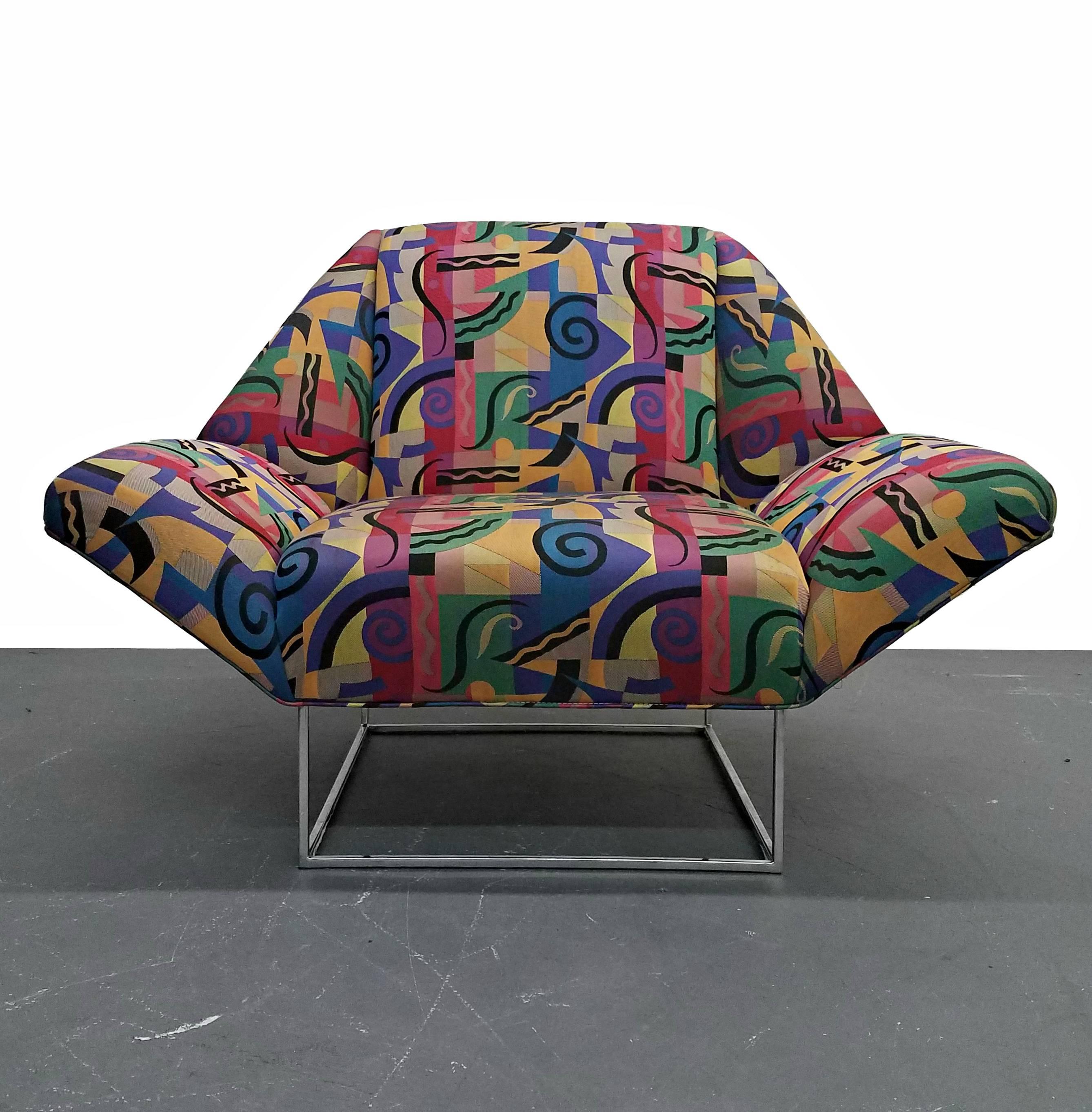 Fun and funky oversized Mid-Century lounge chair. This vintage piece was recovered in the 1990s in this signature contemporary fabric. It is in great shape but the opportunities for reupholster are endless.

Professional reupholstery available for